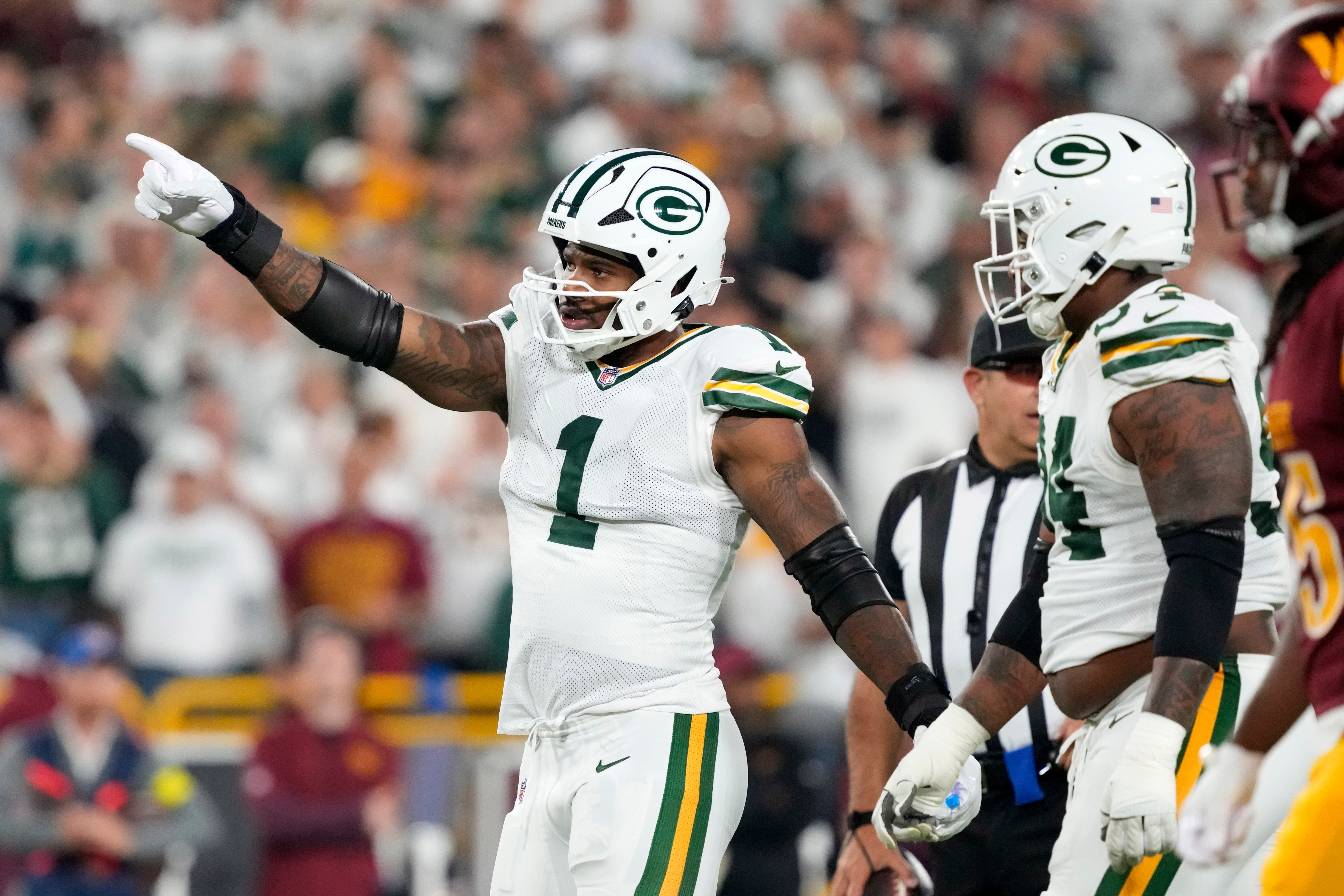 Sep 11, 2025; Green Bay, Wisconsin, USA; Green Bay Packers defensive end Micah Parsons (1) reacts in the first quarter against the Washington Commanders at Lambeau Field.