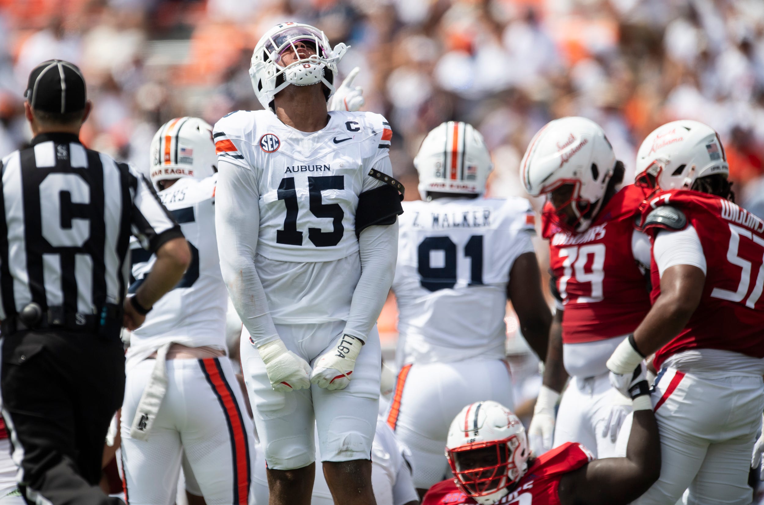 Auburn Tigers defensive end Keldric Faulk (15) celebrates a stop as Auburn Tigers take on South Alabama Jaguars at Jordan-Hare Stadium in Auburn, Ala. on Saturday, Sept. 13, 2025. Auburn Tigers lead South Alabama Jaguars 28-9 at halftime.