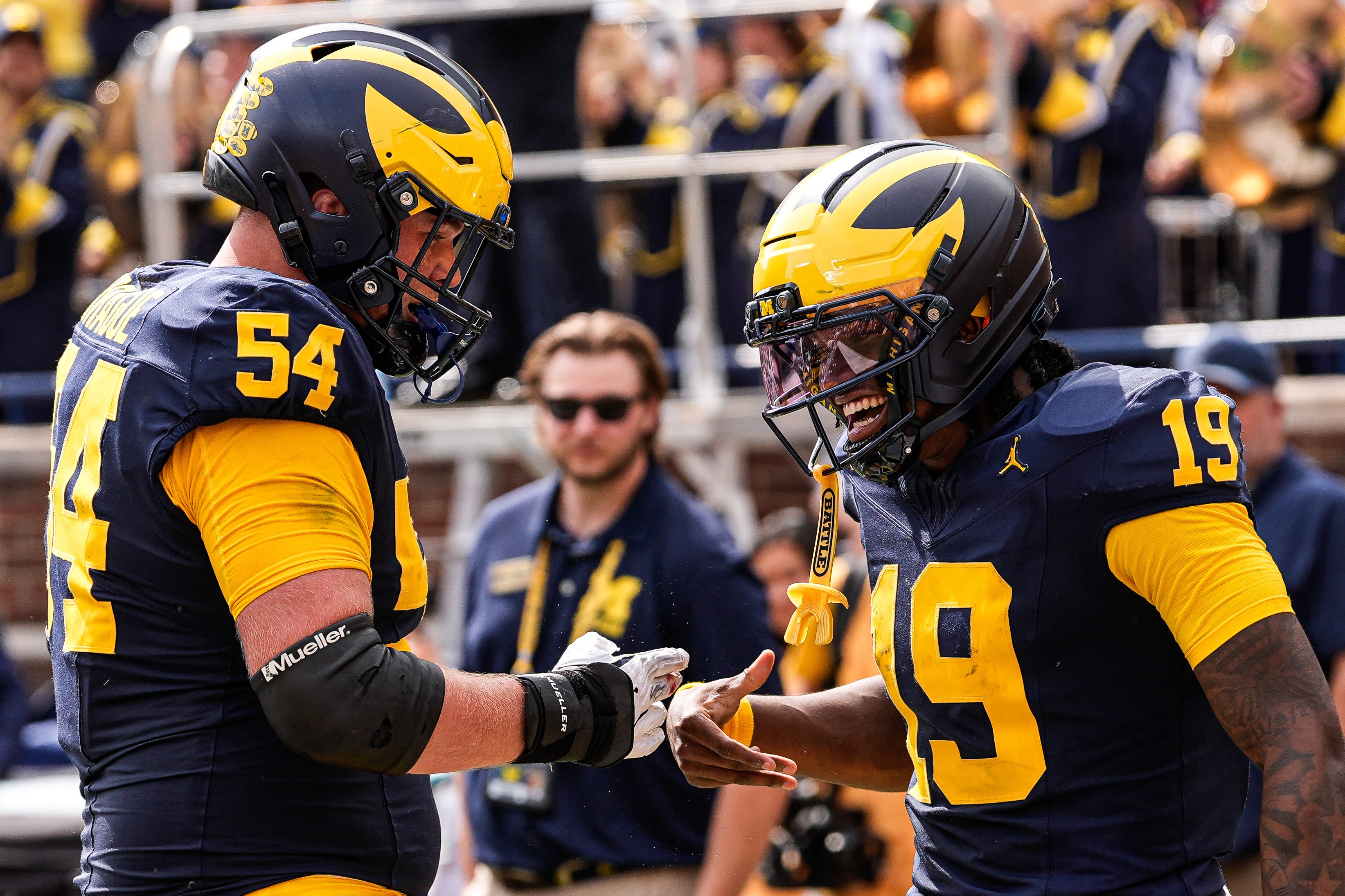 Michigan quarterback Bryce Underwood (19) celebrates a touchdown against Central Michigan with offensive lineman Andrew Sprague (54) during the second half at Michigan Stadium in Ann Arbor on Saturday, Sept. 13, 2025.