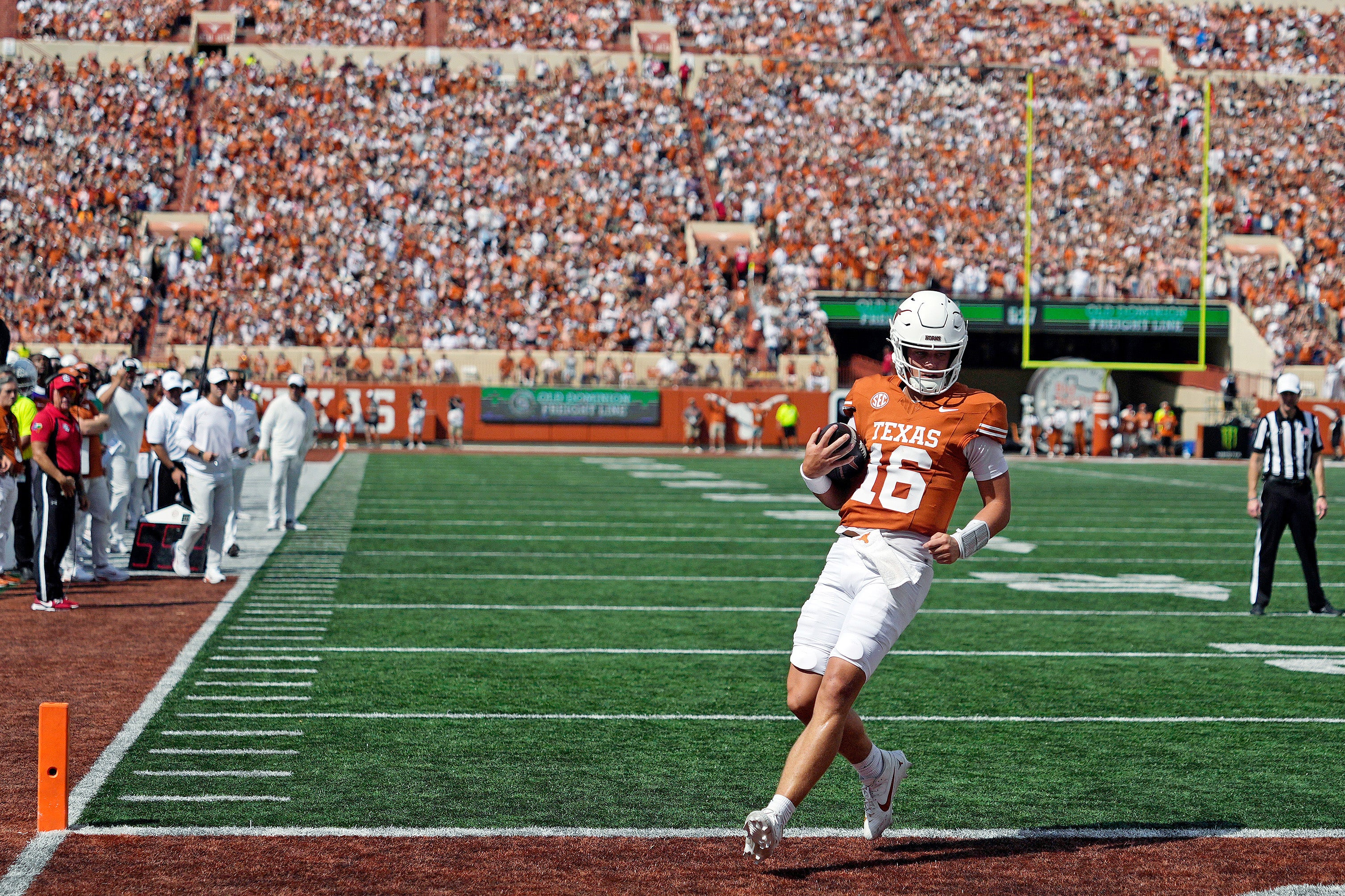 Sep 13, 2025; Austin, Texas, USA; Texas Longhorns quarterback Arch Manning (16) keeps the ball for a touchdown during the first half against the Texas El Paso Miners at Darrell K Royal-Texas Memorial Stadium.