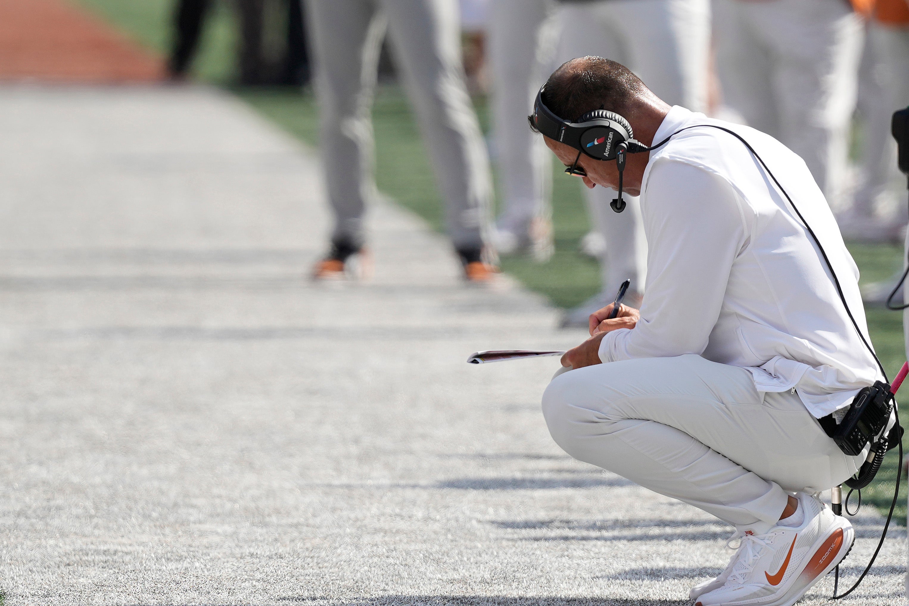 Sep 13, 2025; Austin, Texas, USA; Texas Longhorns head coach Steve Sarkisian takes notes during the first half against the Texas El Paso Miners at Darrell K Royal-Texas Memorial Stadium.