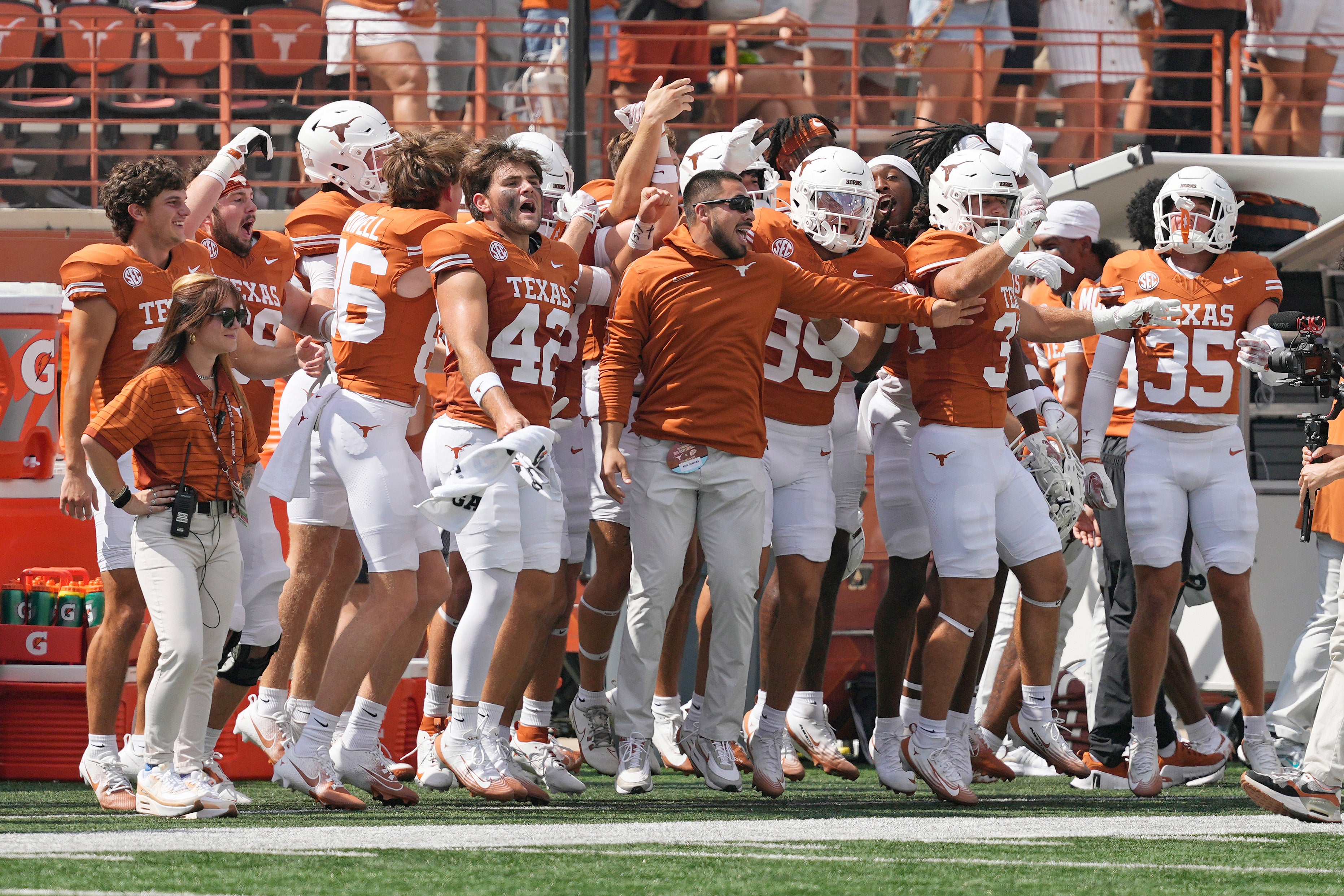 Sep 13, 2025; Austin, Texas, USA; Texas Longhorns bench players and coaches react before the kickoff to start a game against the Texas El Paso Miners at Darrell K Royal-Texas Memorial Stadium.