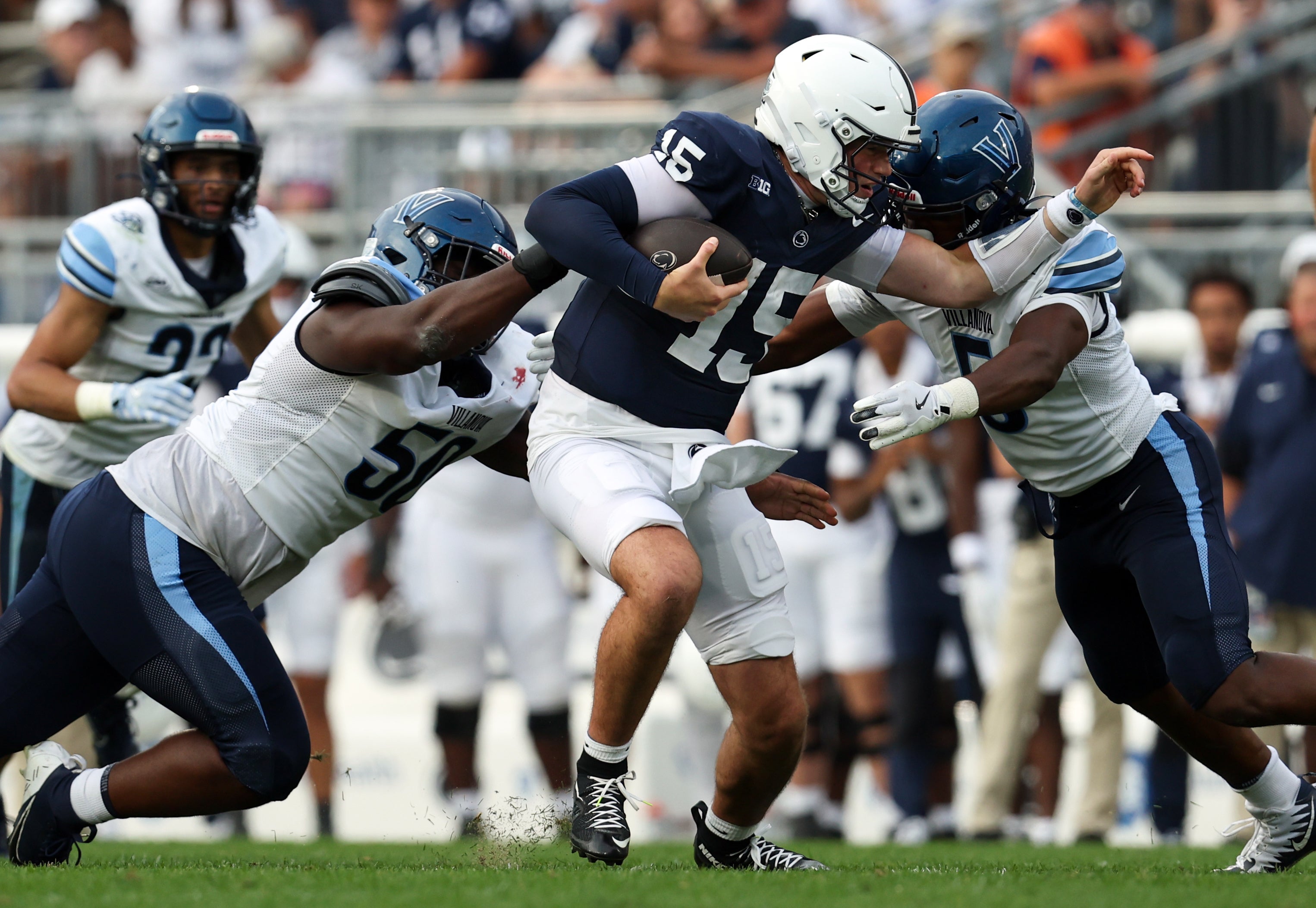 Sep 13, 2025; University Park, Pennsylvania, USA; Penn State Nittany Lions quarterback Drew Allar (15) runs with the ball while trying to avoid a tackle during the third quarter against the Villanova Wildcats at Beaver Stadium. Mandatory Credit: Matthew O'Haren-Imagn Images