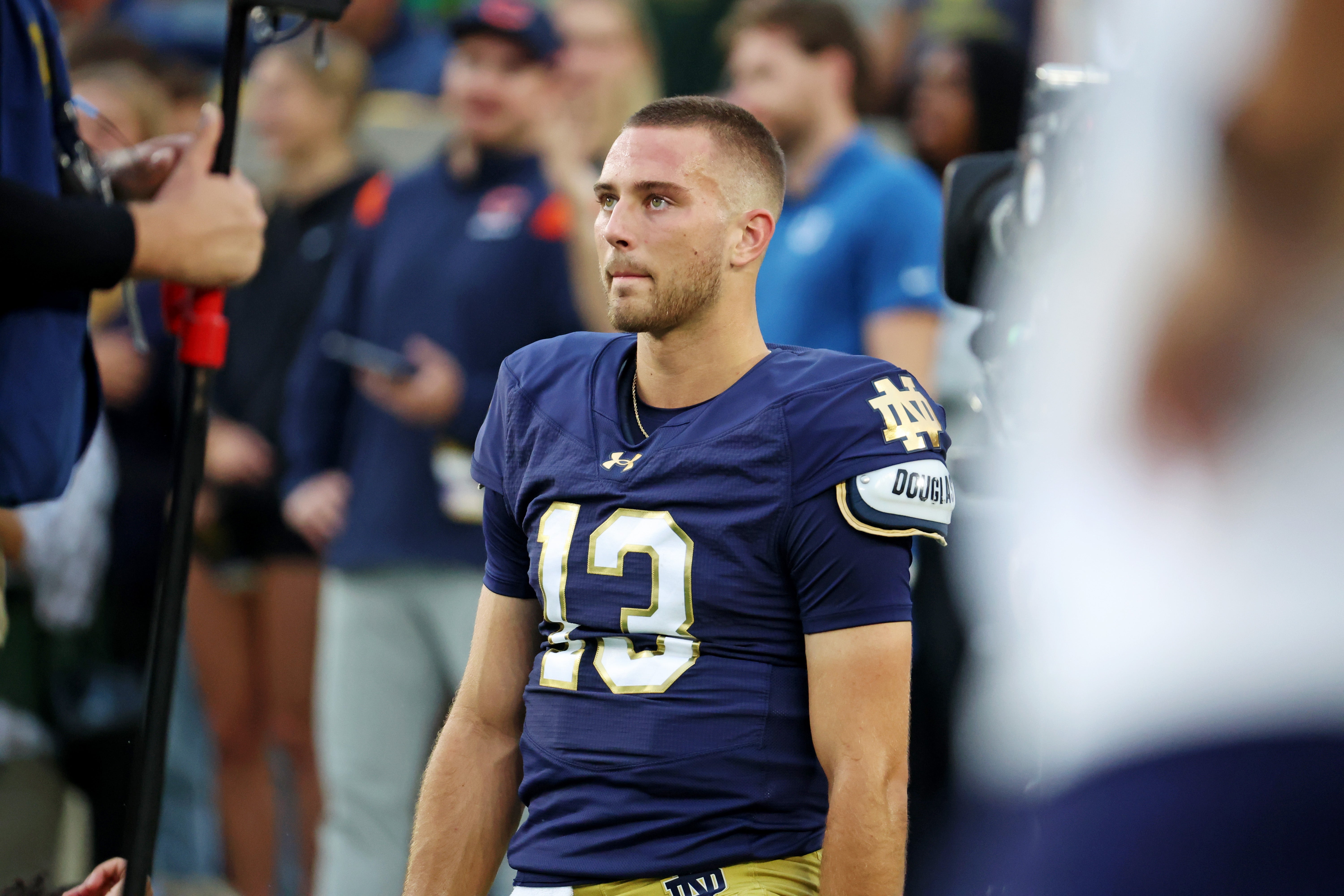 Sep 13, 2025; South Bend, Indiana, USA; Notre Dame Fighting Irish quarterback CJ Carr (13) looks on during the first half against the Texas A&M Aggies at Notre Dame Stadium. Mandatory Credit: Trevor Ruszkowski-Imagn Images