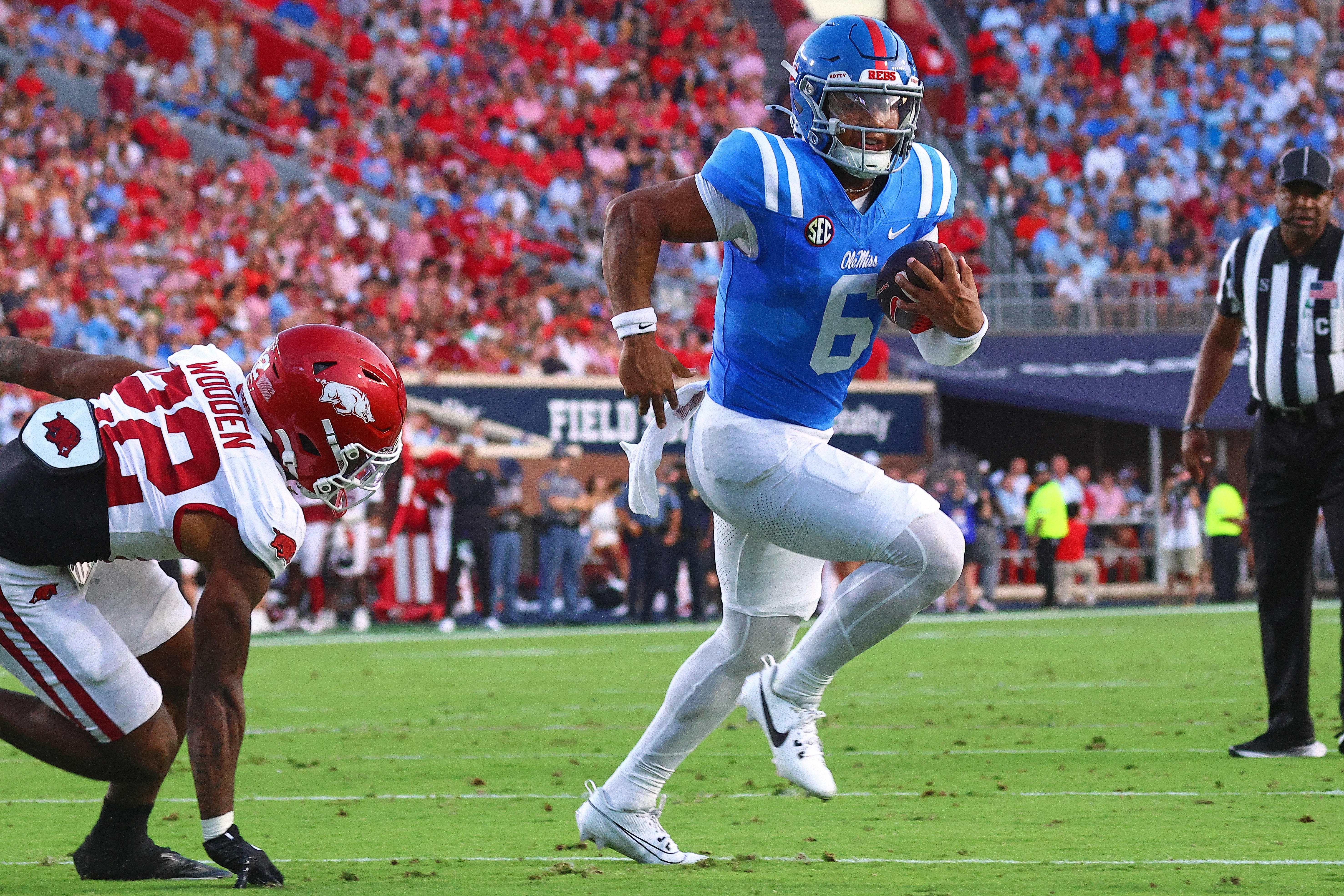 Sep 13, 2025; Oxford, Mississippi, USA; Mississippi Rebels quarterback Trinidad Chambliss (6) runs the ball for a touchdown during the second quarter against the Arkansas Razorback at Vaught-Hemingway Stadium.