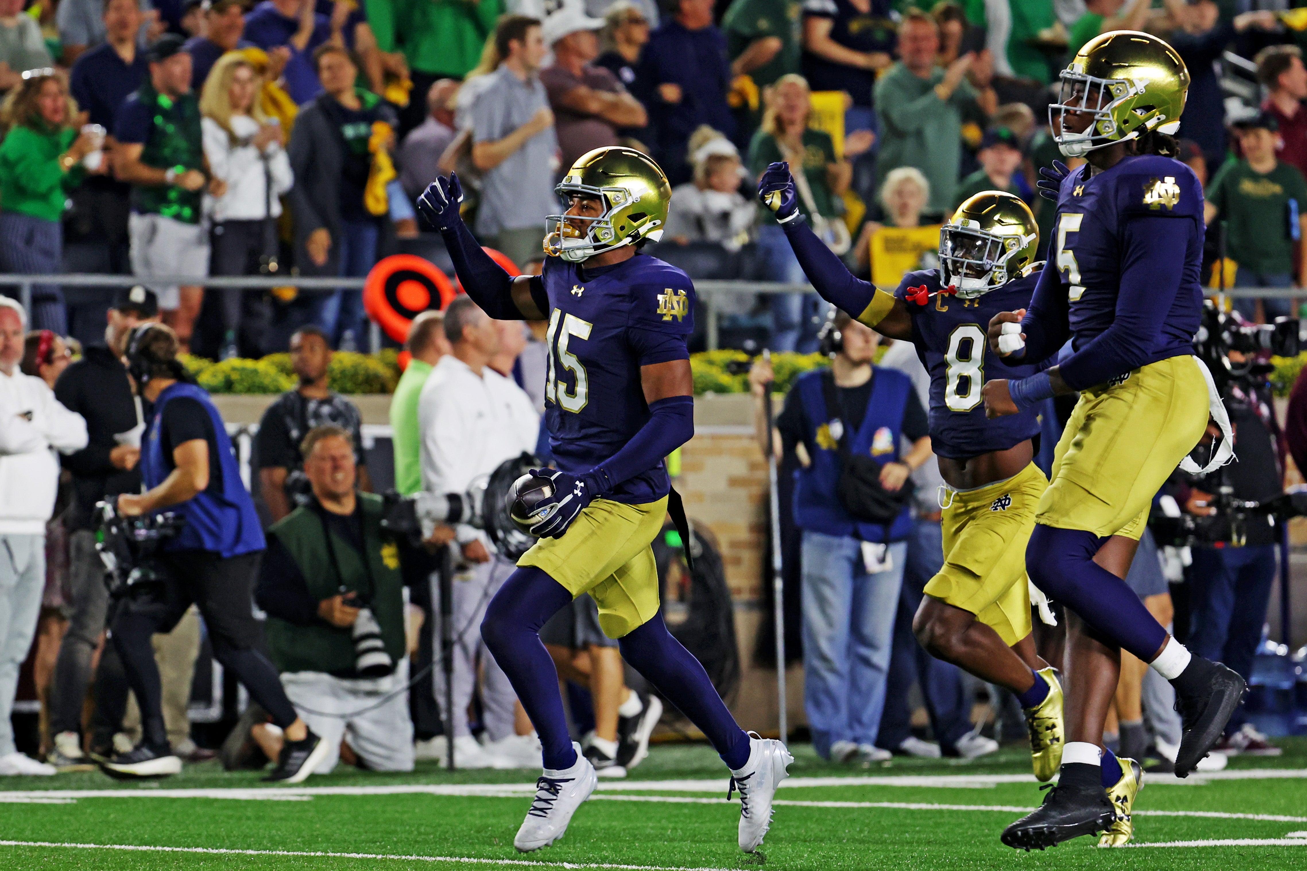 Sep 13, 2025; South Bend, Indiana, USA; Notre Dame Fighting Irish cornerback Leonard Moore (15) reacts after a play against the Texas A&M Aggies during the first half at Notre Dame Stadium. Mandatory Credit: Trevor Ruszkowski-Imagn Images