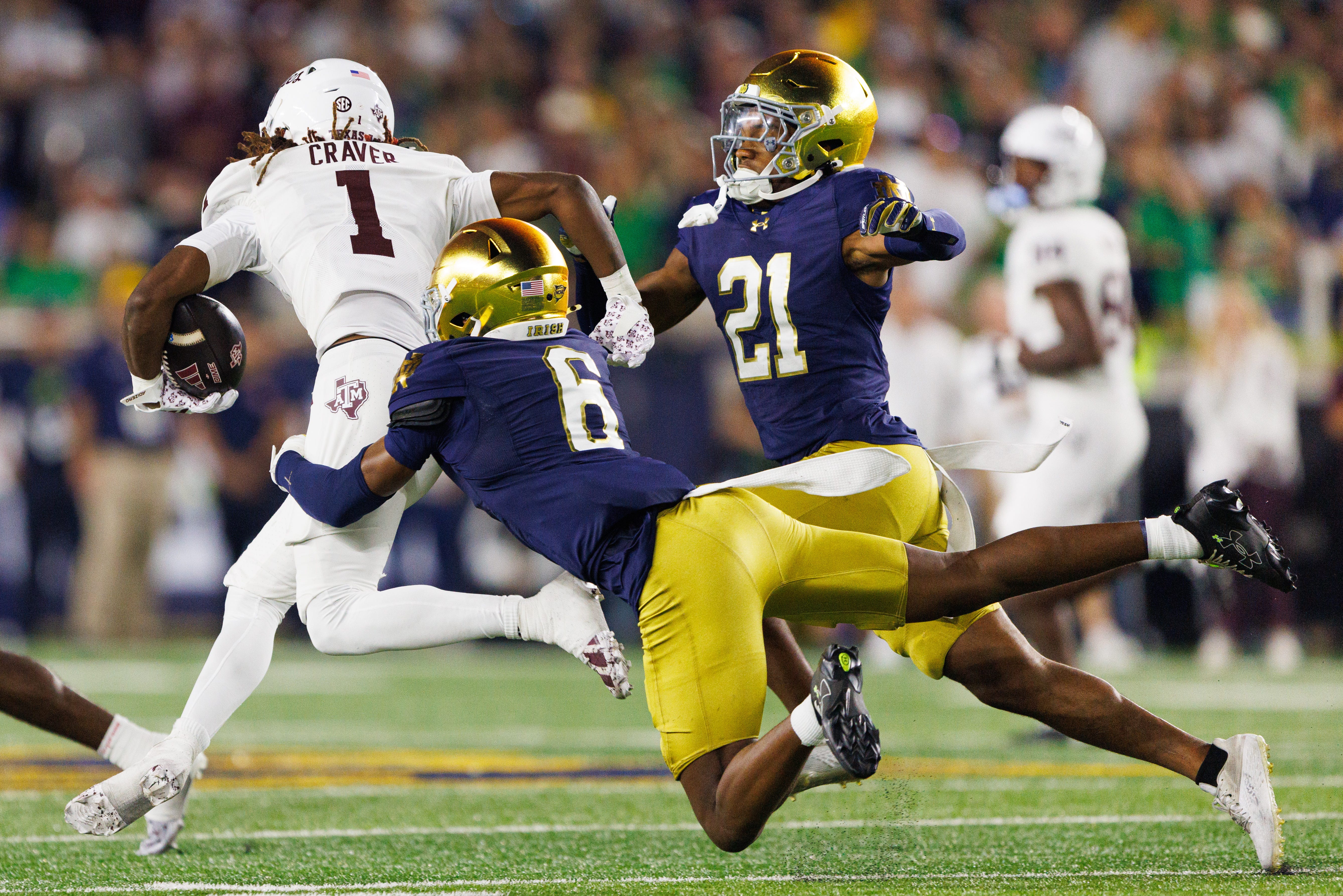 Notre Dame cornerback Christian Gray (6) tackles Texas A&M wide receiver Mario Craver (1) in the first half of a NCAA football game at Notre Dame Stadium on Saturday, Sept. 13, 2025, in South Bend.