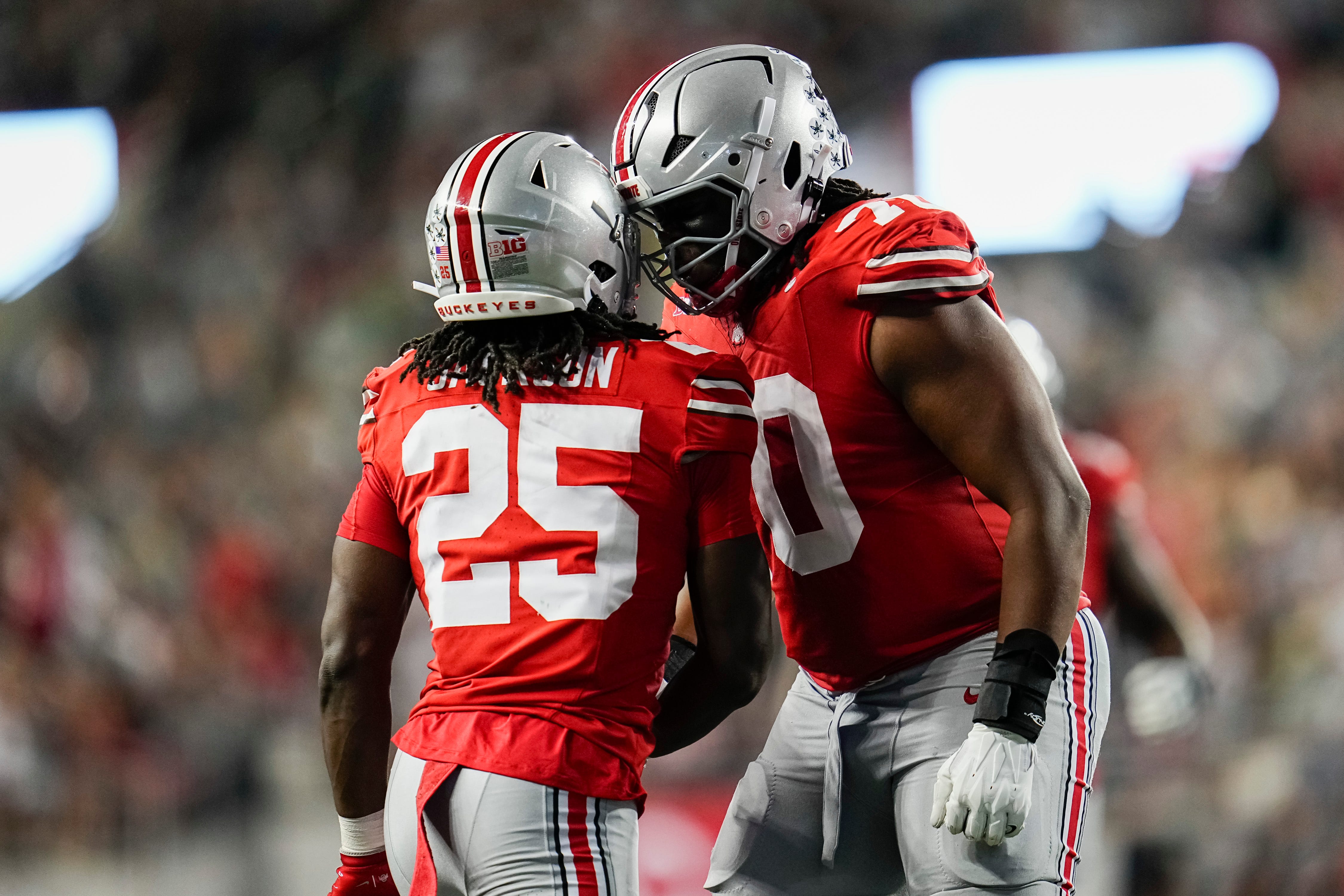 Ohio State Buckeyes offensive lineman Phillip Daniels (70) reacts to a long run by running back Bo Jackson (25) during the second half of the NCAA football game against the Ohio Bobcats at Ohio Stadium on Sept. 13, 2025. Ohio State won 37-9.