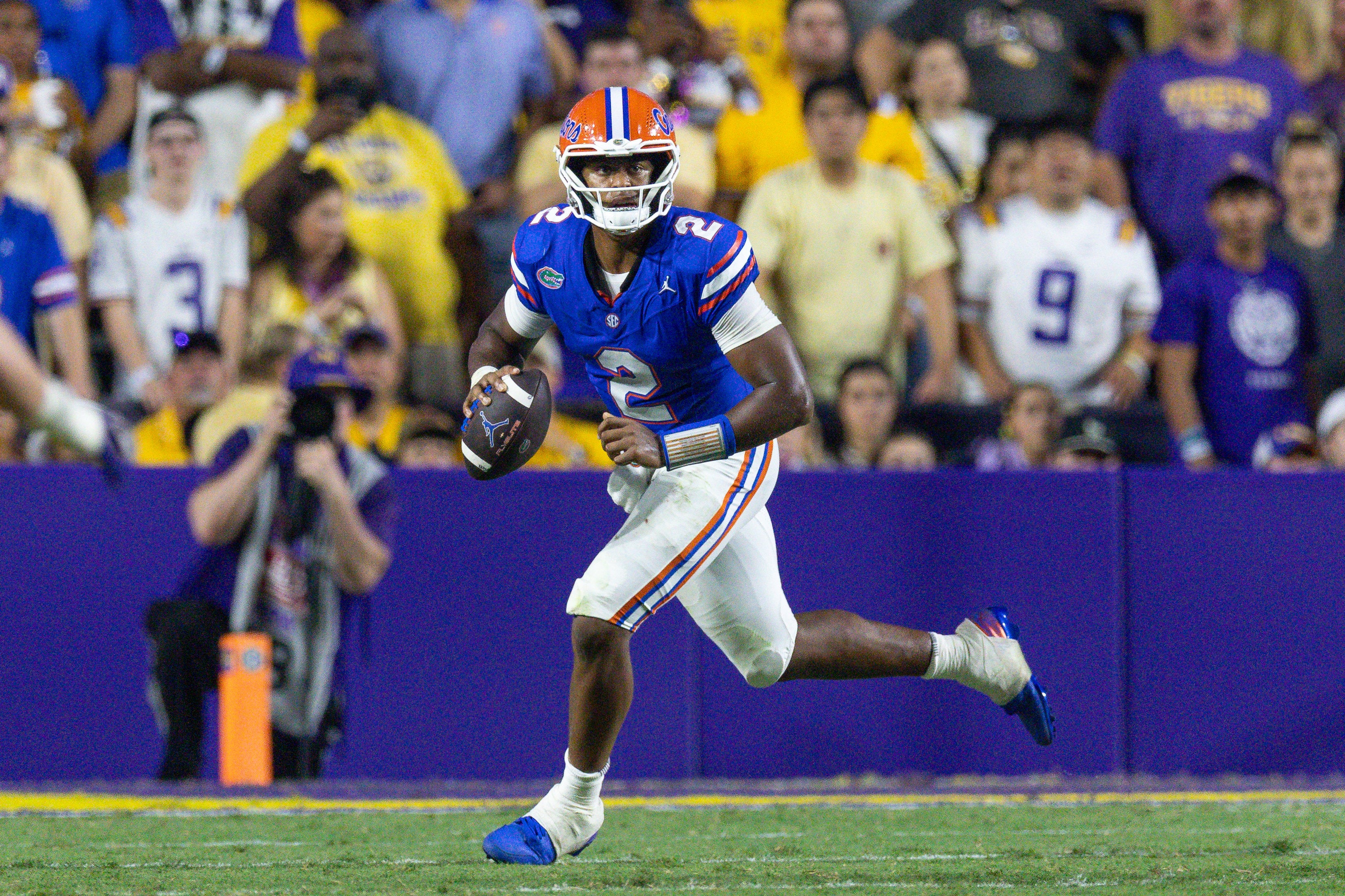Sep 13, 2025; Baton Rouge, Louisiana, USA; Florida Gators quarterback DJ Lagway (2) scrambles out the pocket to pass against the LSU Tigers during the second half at Tiger Stadium. Mandatory Credit: Stephen Lew-Imagn Images