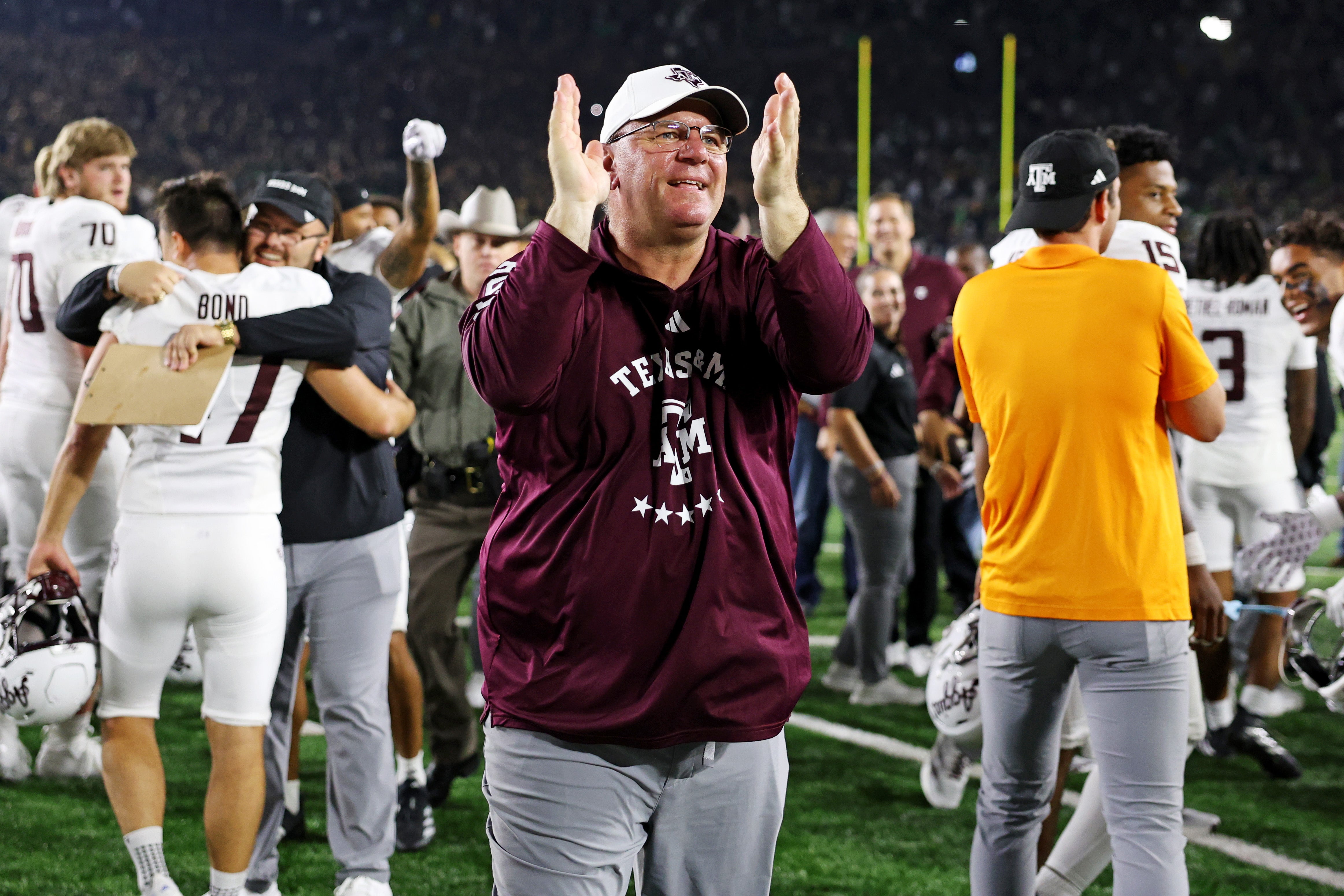 Sep 13, 2025; South Bend, Indiana, USA; Texas A&M Aggies head coach Mike Elko celebrates after the game against Notre Dame Fighting Irish at Notre Dame Stadium. Mandatory Credit: Trevor Ruszkowski-Imagn Images