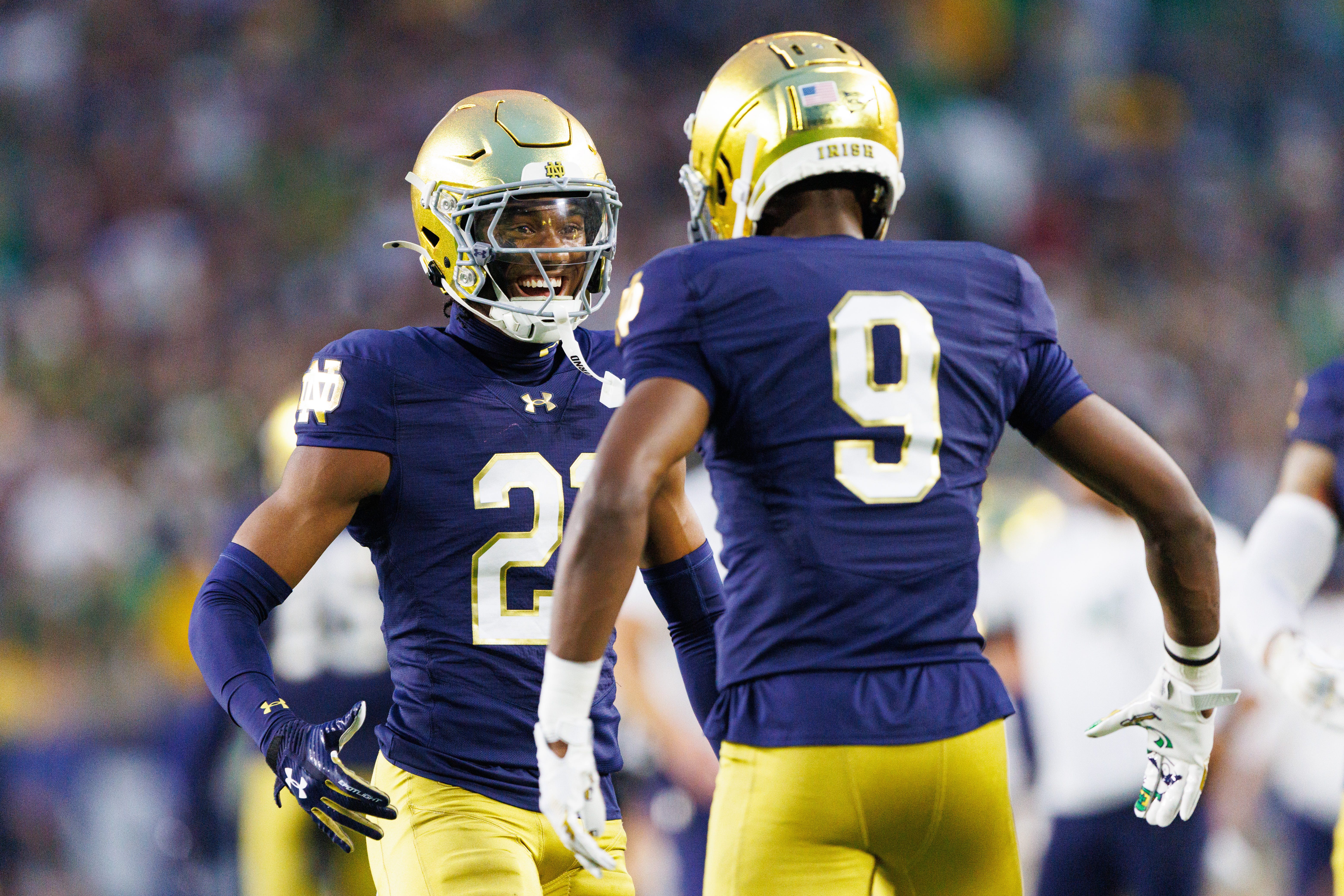 Notre Dame cornerback Karson Hobbs (21) and safety Tae Johnson (9) celebrate after getting a stop in the first half of a NCAA football game against Texas A&M at Notre Dame Stadium on Saturday, Sept. 13, 2025, in South Bend.
