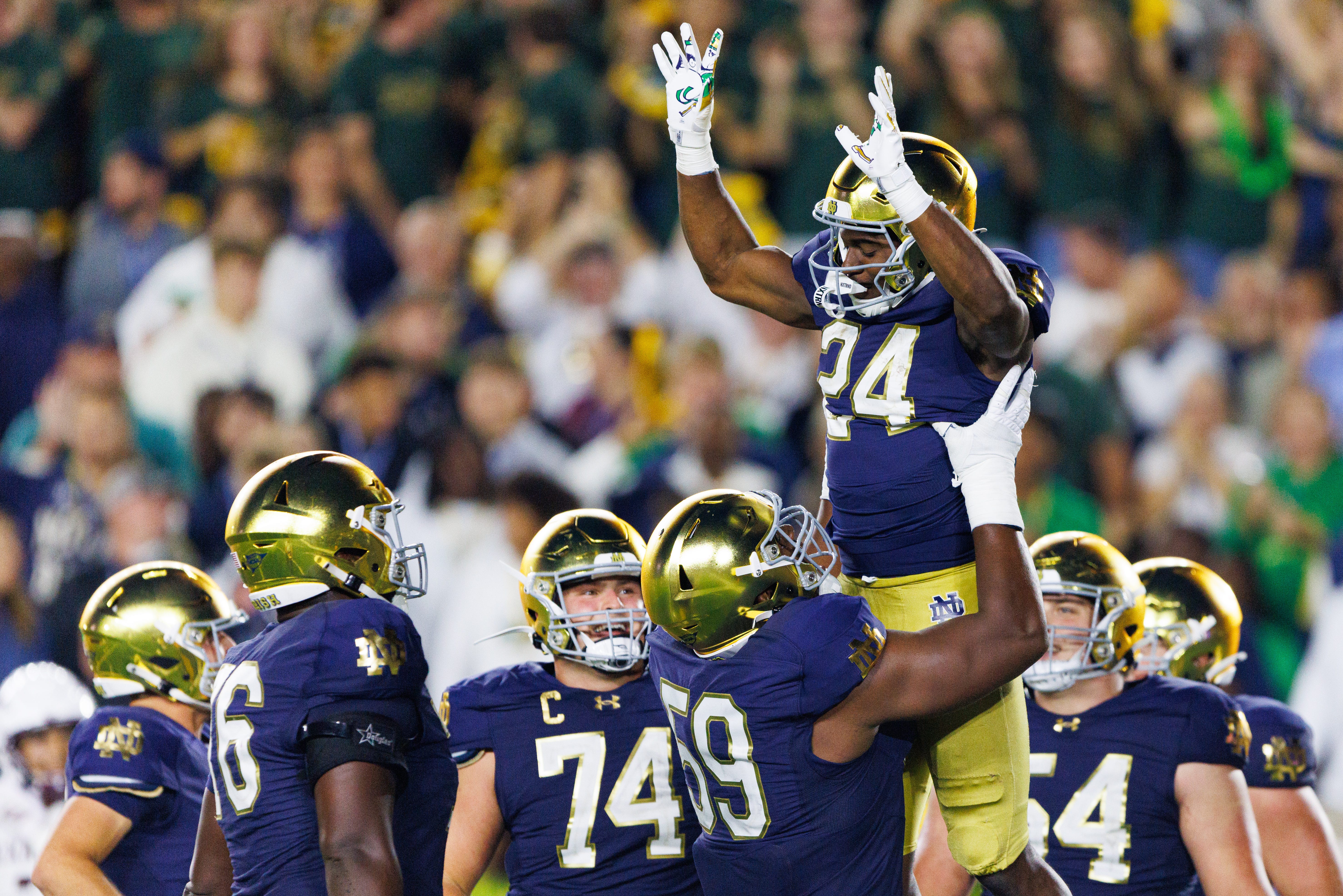 Notre Dame offensive lineman Aamil Wagner (59) lifts up running back Jadarian Price (24) after a Price touchdown in the second half of a NCAA football game against Texas A&M at Notre Dame Stadium on Saturday, Sept. 13, 2025, in South Bend.