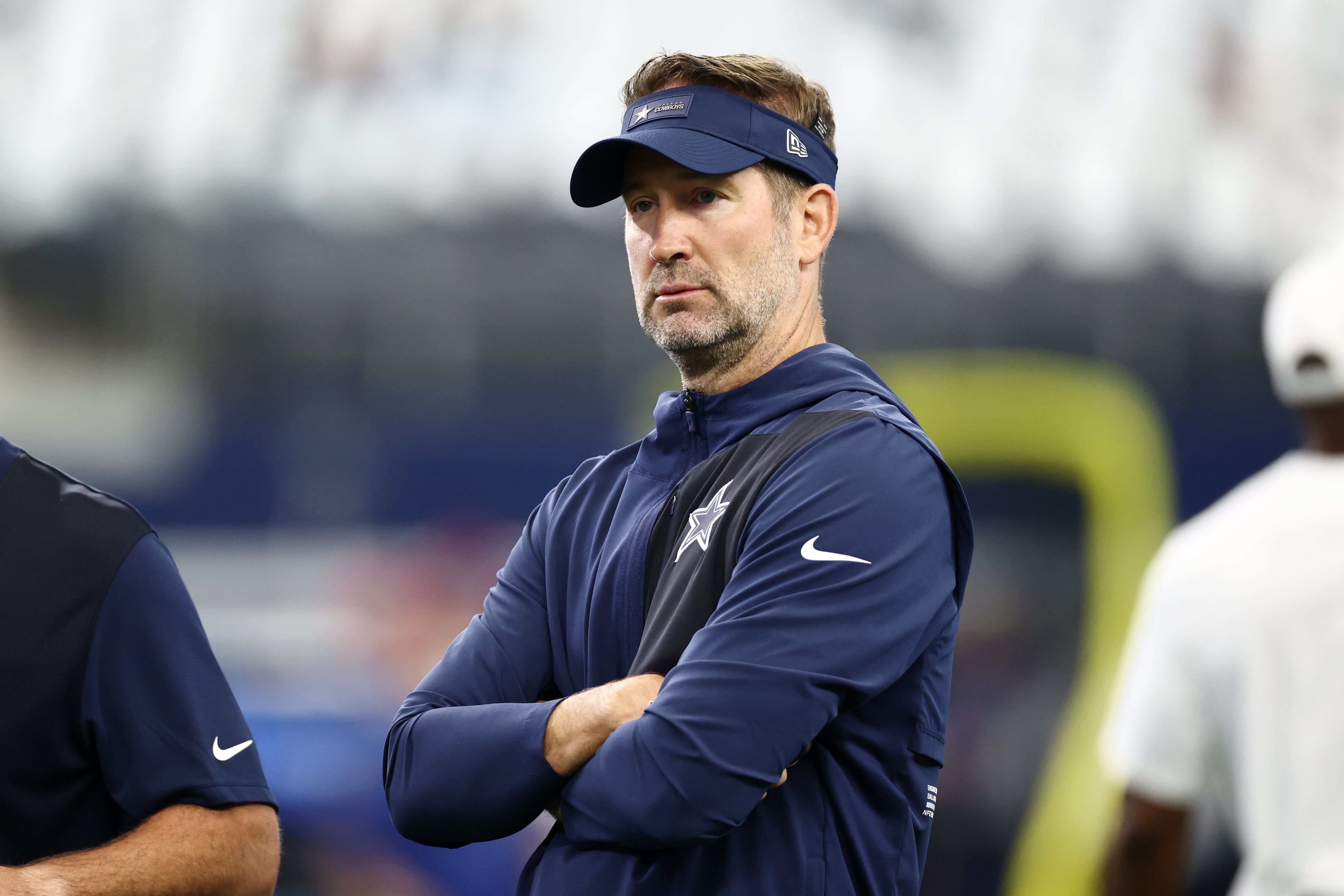 Sep 14, 2025; Arlington, Texas, USA; Dallas Cowboys head coach Brian Schottenheimer looks on during warmups before the game New York Giants at AT&T Stadium.