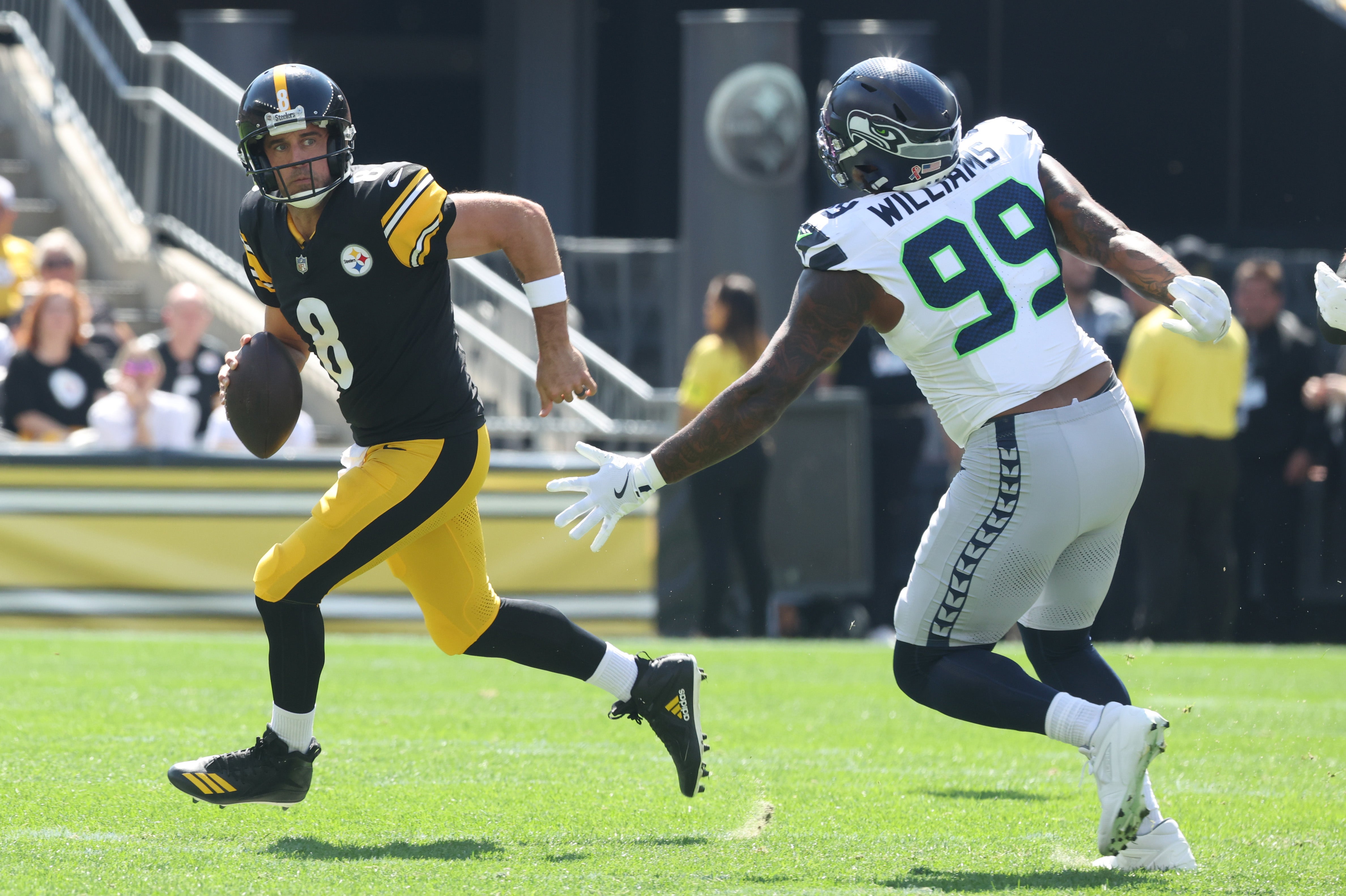 Sep 14, 2025; Pittsburgh, Pennsylvania, USA; Pittsburgh Steelers quarterback Aaron Rodgers (8) looks to pass against the Seattle Seahawks during the first quarter at Acrisure Stadium.
