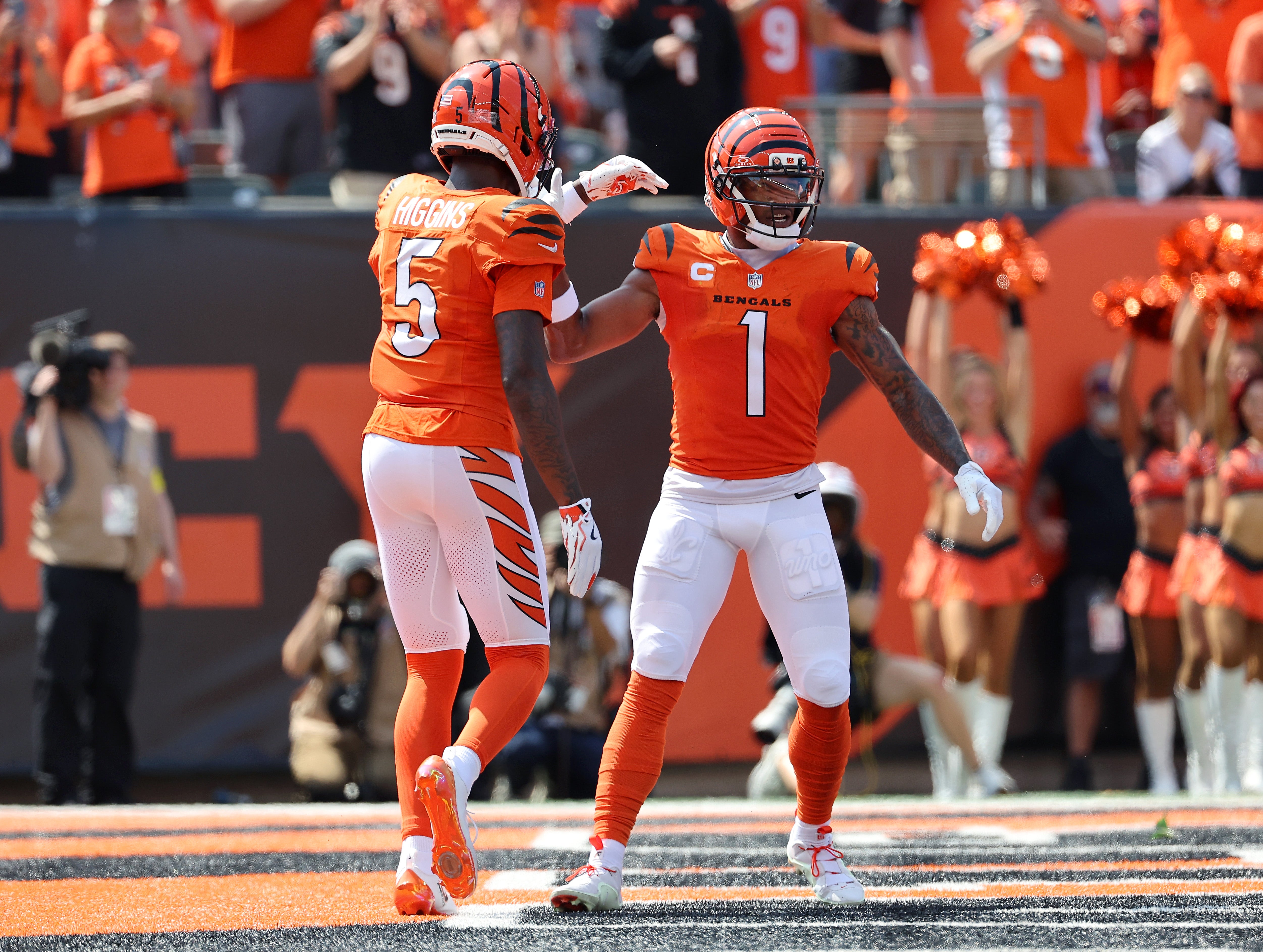 Sep 14, 2025; Cincinnati, Ohio, USA; Cincinnati Bengals wide receiver Ja'Marr Chase (1) celebrates his touchdown with wide receiver Tee Higgins (5) during the first quarter against the Jacksonville Jaguars at Paycor Stadium.