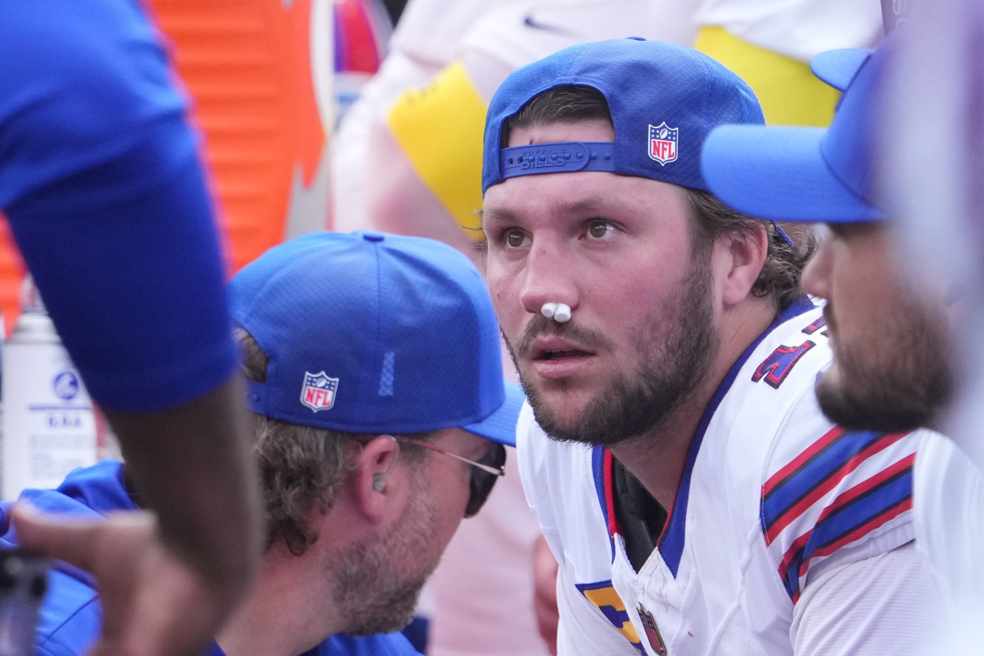Sep 14, 2025; East Rutherford, New Jersey, USA; Buffalo Bills quarterback Josh Allen (17) is tended to by medical staff on the bench during the first half at MetLife Stadium.