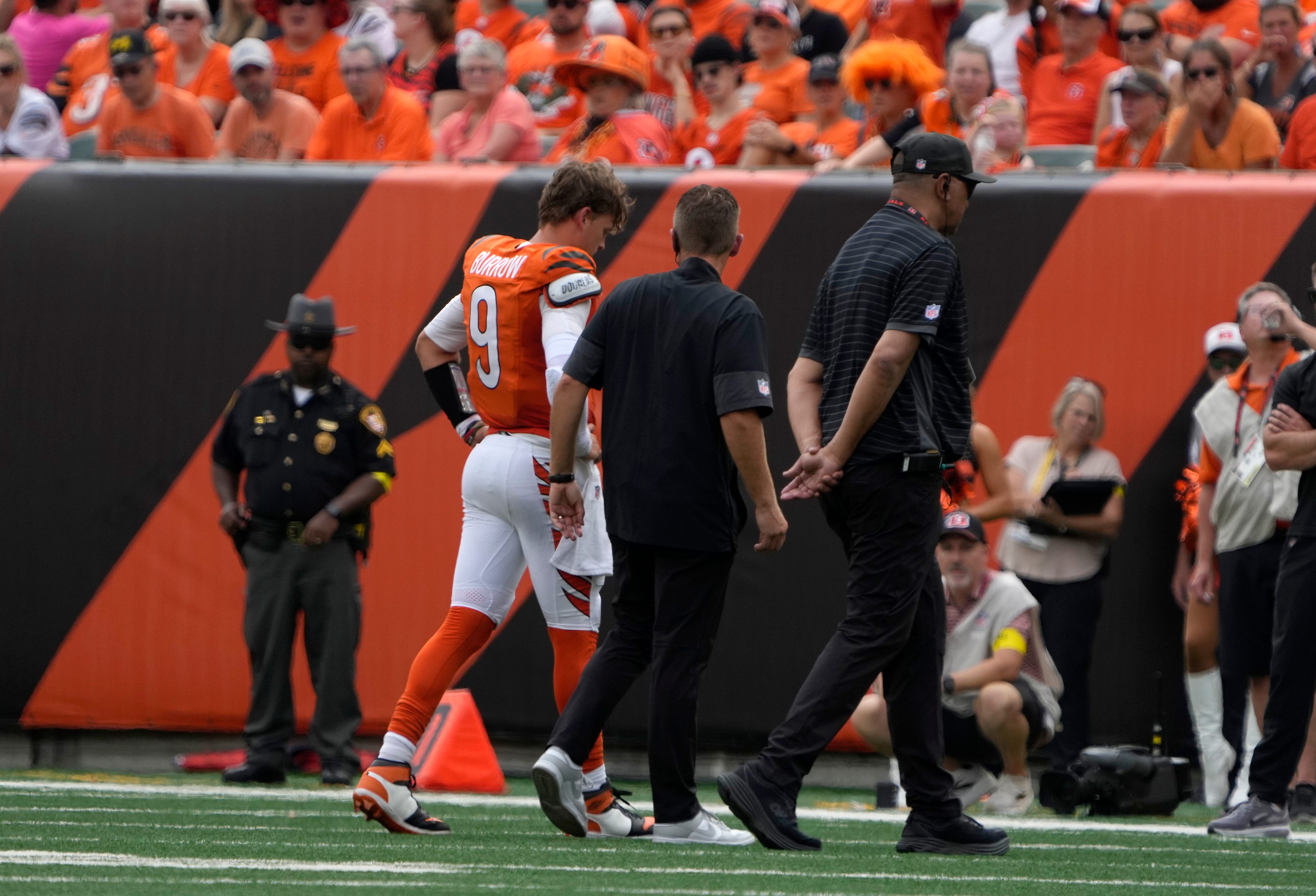 Cincinnati Bengals quarterback Joe Burrow (9) walks off the field after an injury during the 2nd quarter against the Jacksonville Jaguars at Paycor Stadium on Sunday, September 14, 2025.