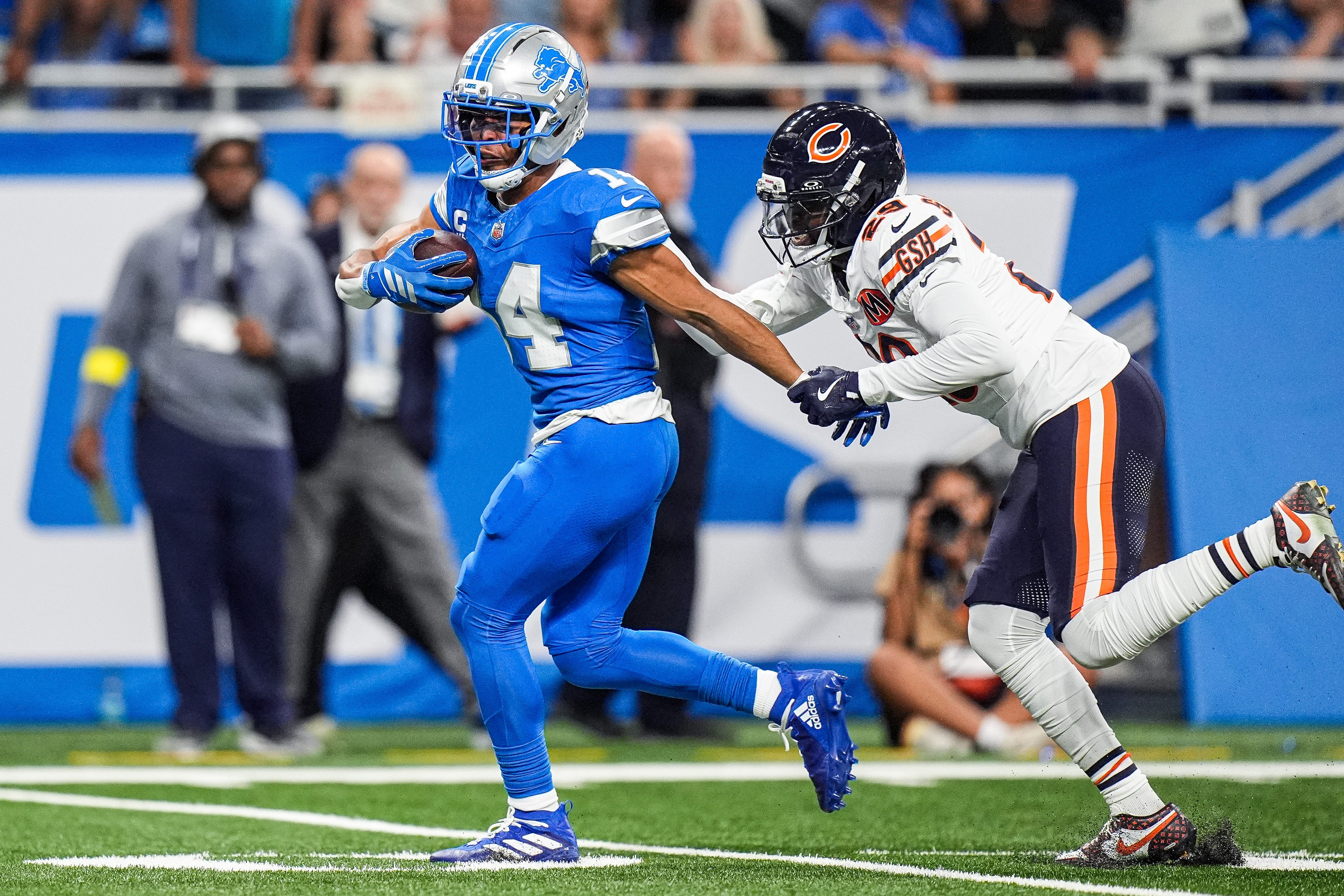 Detroit Lions wide receiver Amon-Ra St. Brown (14) makes a catch against Chicago Bears cornerback Tyrique Stevenson (29) during the first half at Ford Field in Detroit on Sunday, Sept. 14, 2025.
