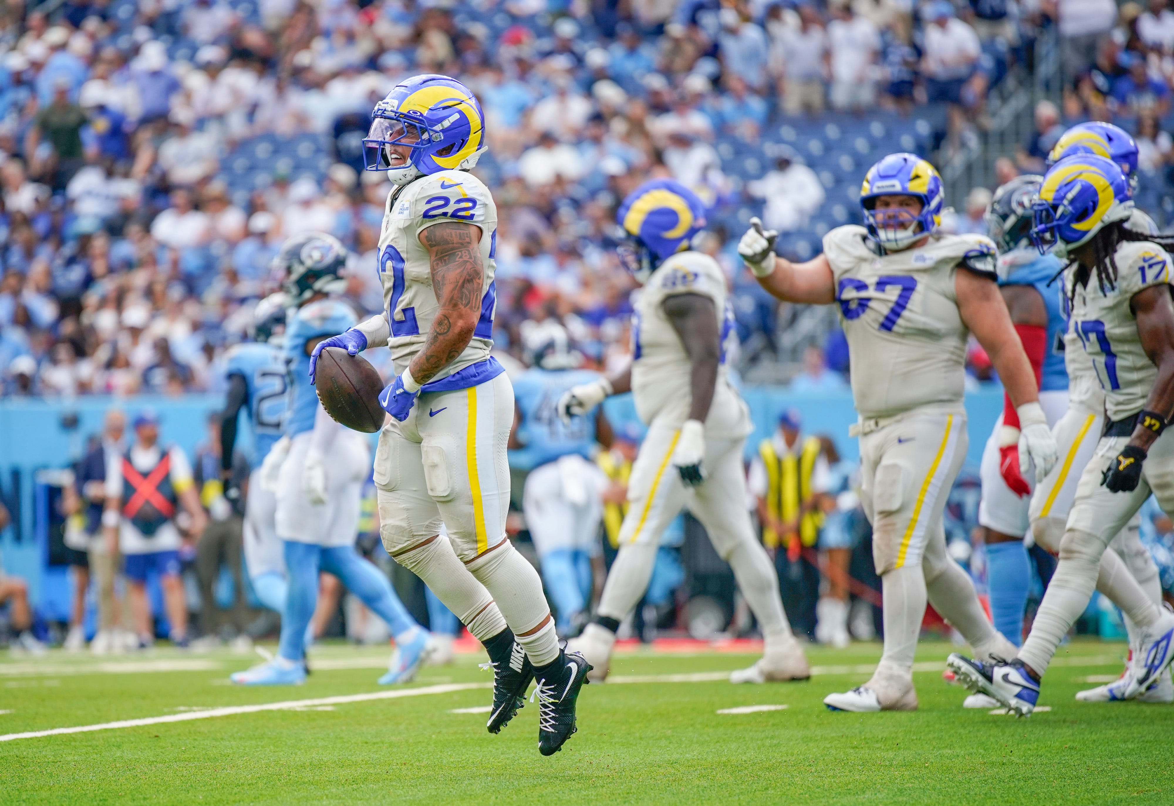 Los Angeles Rams running back Blake Corum (22) celebrates his touchdown against the Tennessee Titans during the fourth quarter at Nissan Stadium in Nashville, Tenn., Sunday, Sept. 14, 2025.