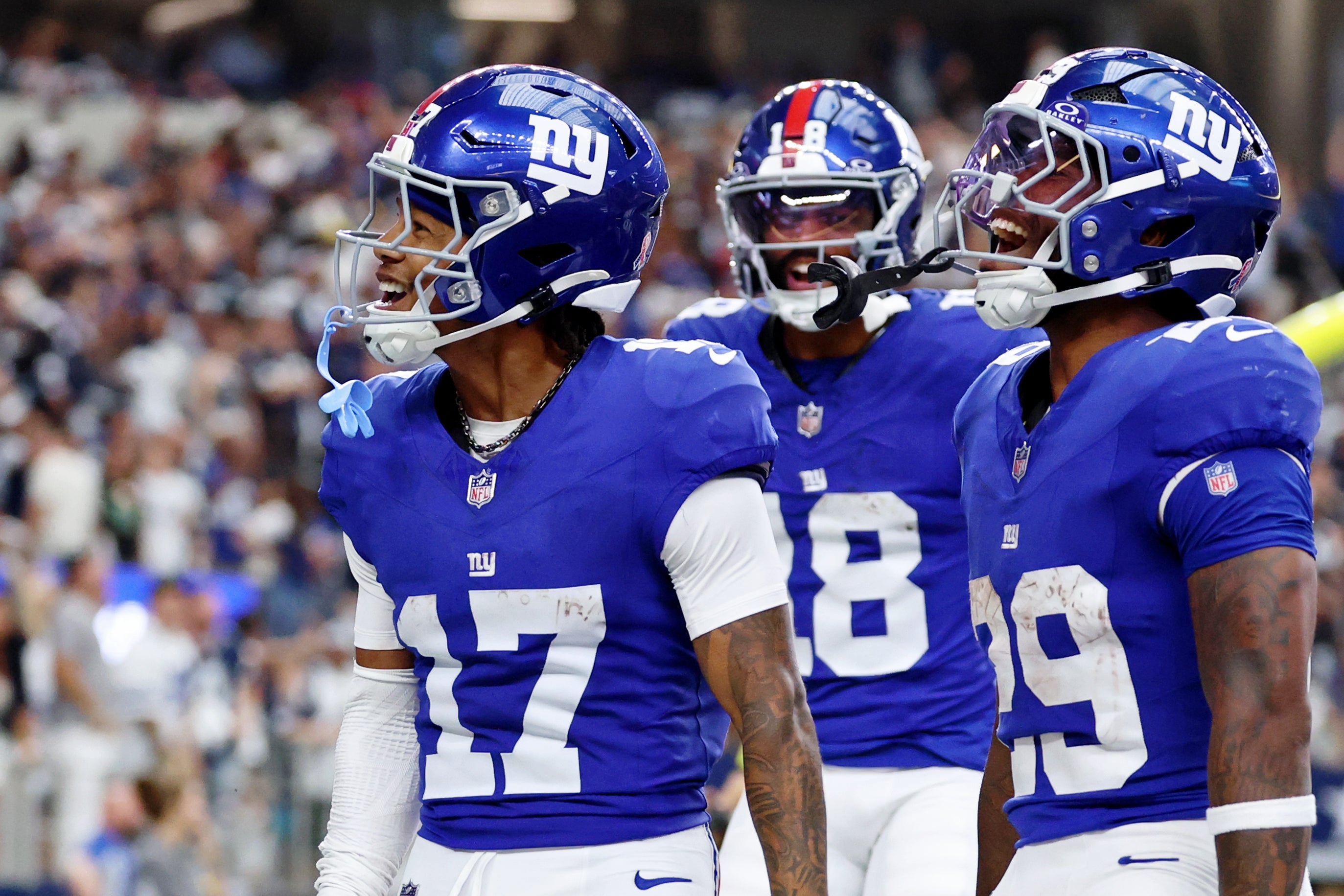 Sep 14, 2025; Arlington, Texas, USA; New York Giants wide receiver Wan'Dale Robinson (17) celebrates after scoring a touchdown against the Dallas Cowboys during the fourth quarter at AT&T Stadium.