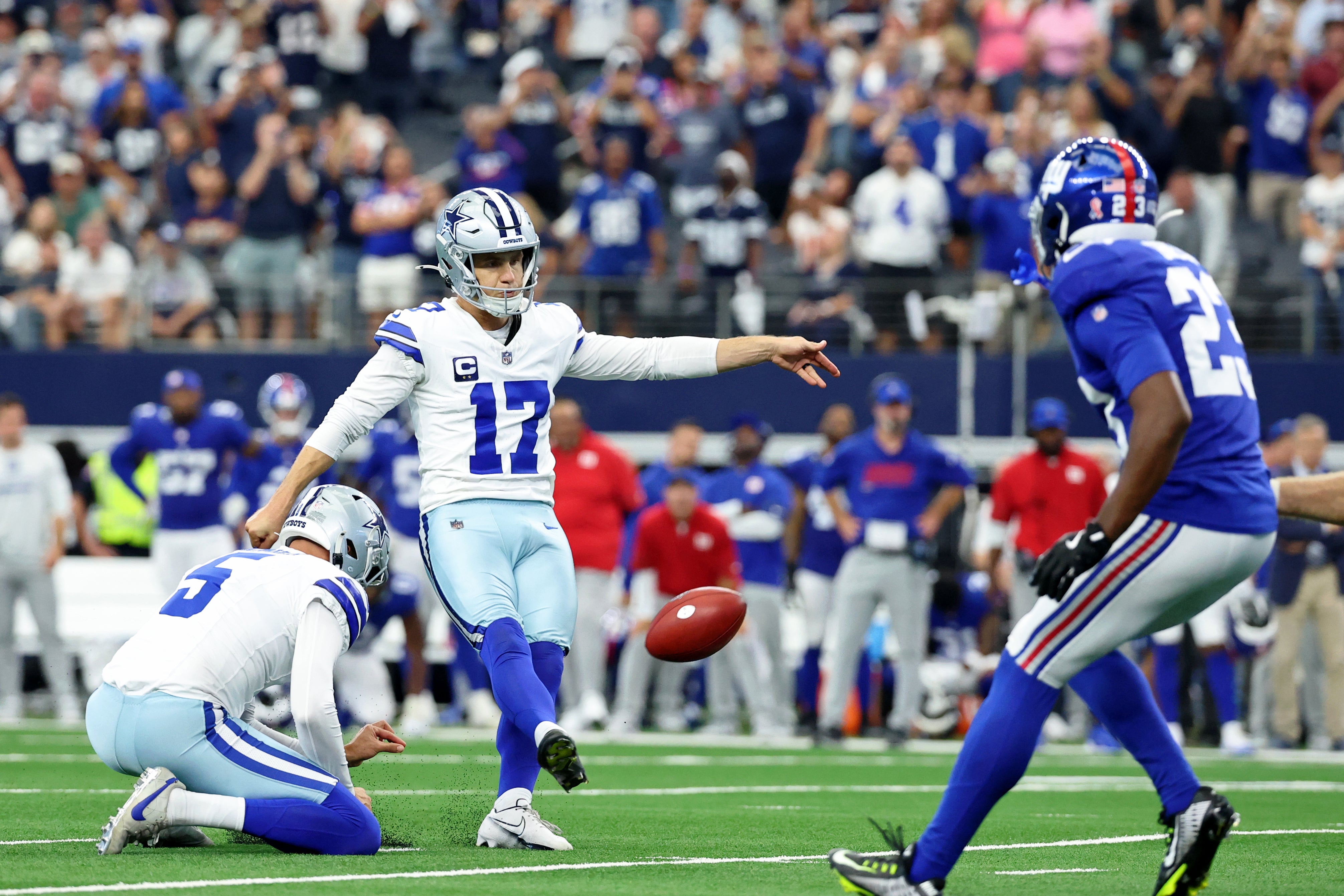Dallas Cowboys place kicker Brandon Aubrey (17) kicks the game-winning field goal against the New York Giants during overtime at AT&T Stadium.