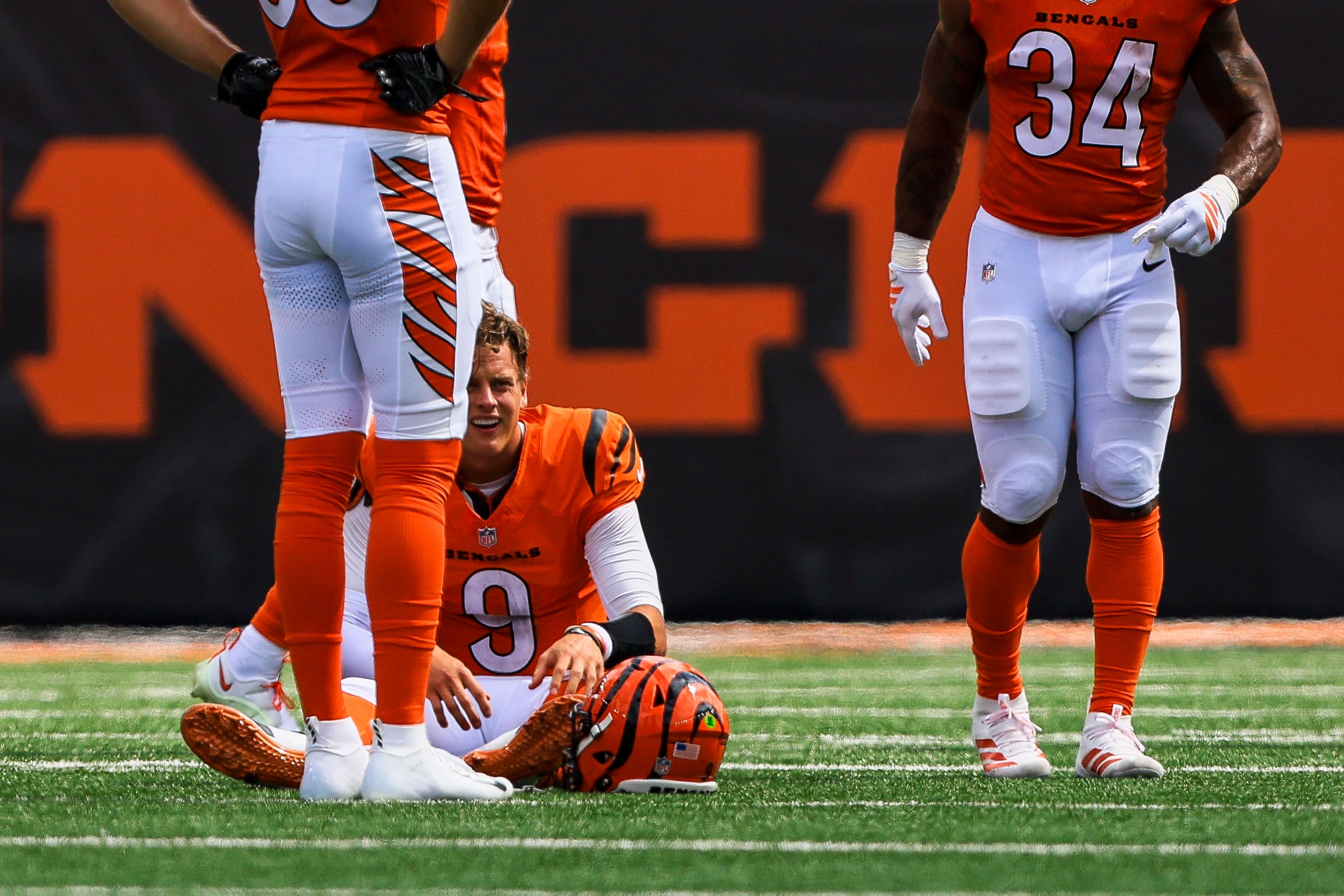 Sep 14, 2025; Cincinnati, Ohio, USA; Cincinnati Bengals quarterback Joe Burrow (9) sits on the ground after a play in the first half against the Jacksonville Jaguars at Paycor Stadium.