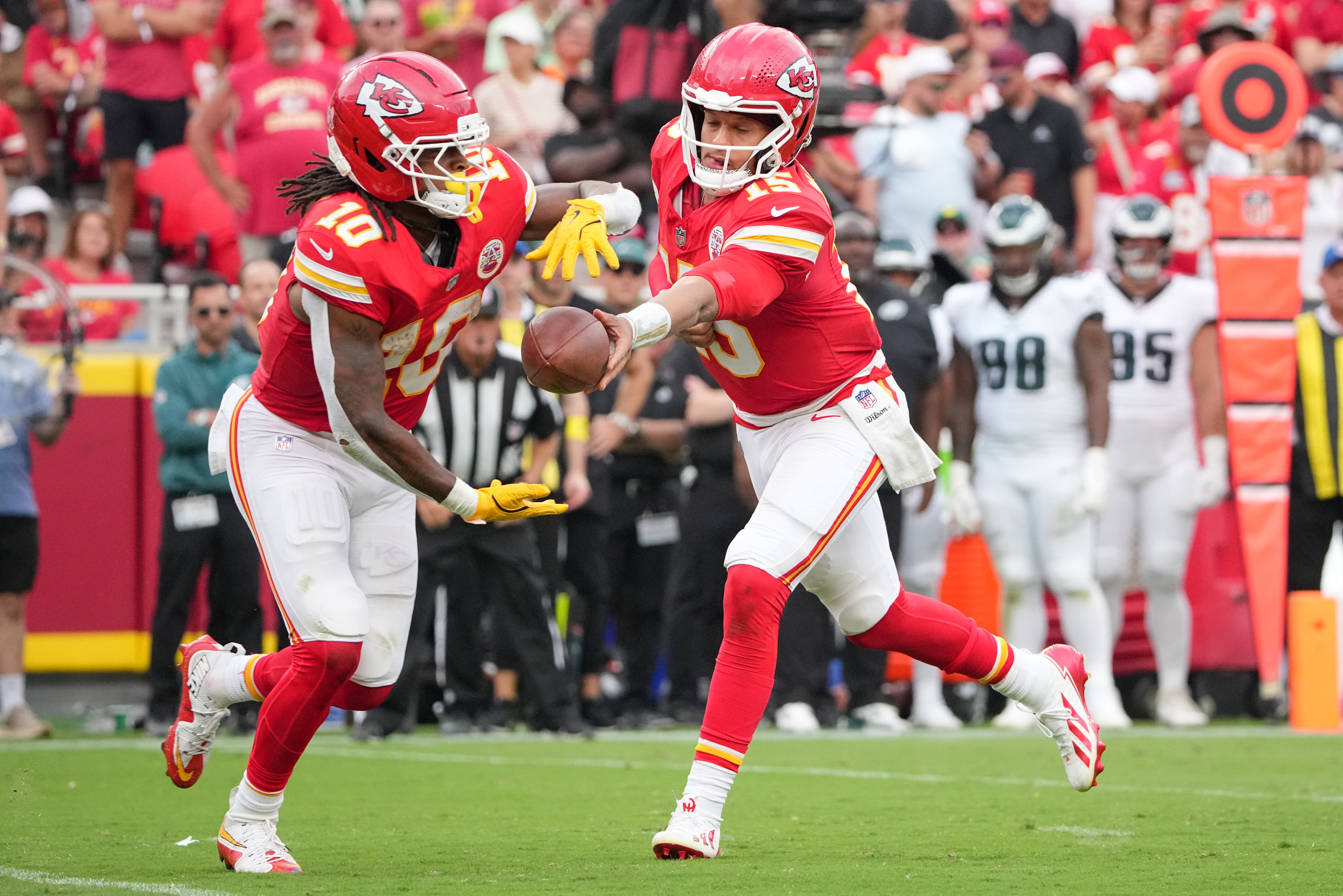 Kansas City Chiefs quarterback Patrick Mahomes (15) hands the ball to running back Isiah Pacheco (10) against the Philadelphia Eagles