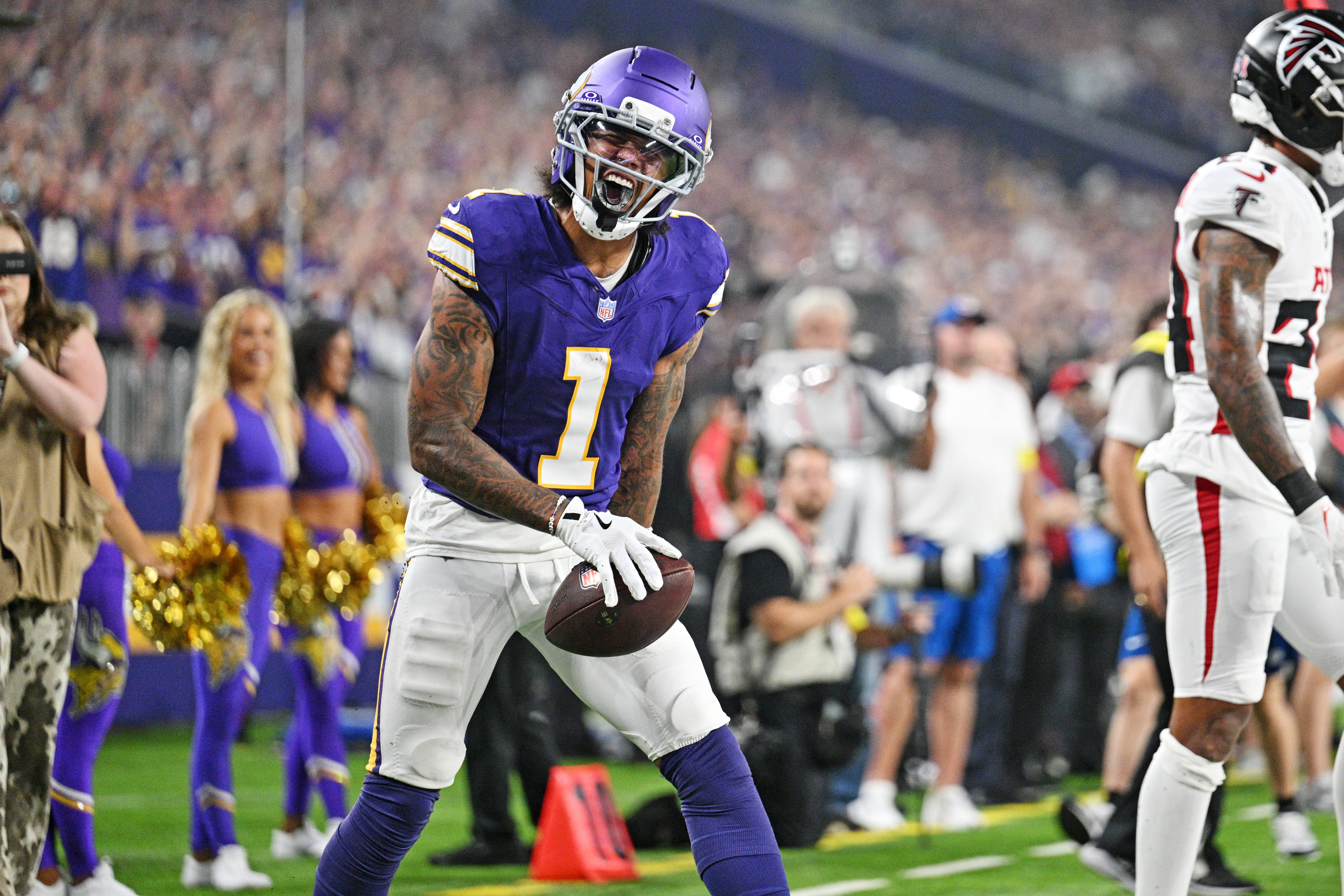 Sep 14, 2025; Minneapolis, Minnesota, USA; Minnesota Vikings wide receiver Jalen Nailor (1) celebrates after a touchdown during the first half against the Atlanta Falcons at U.S. Bank Stadium.