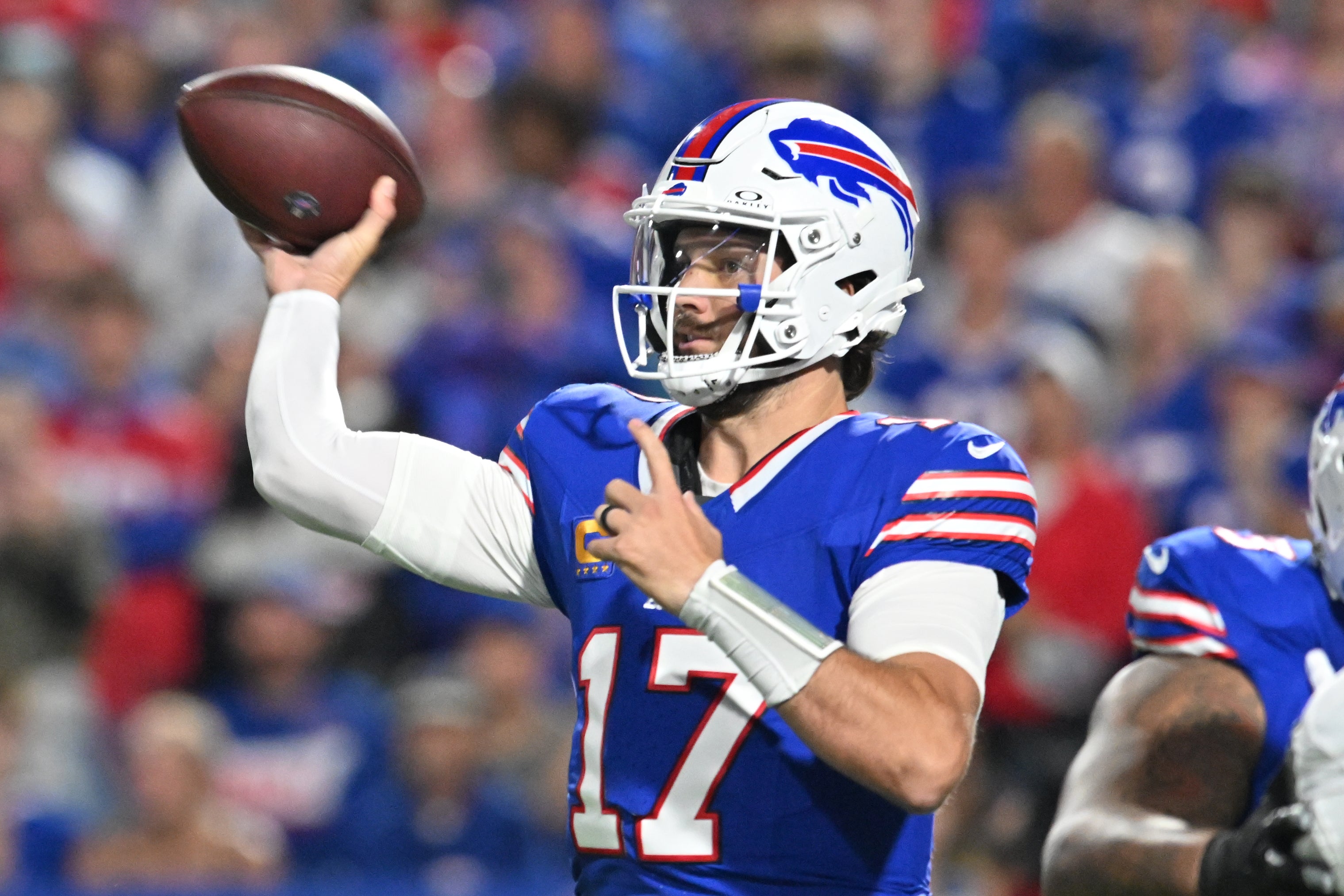 Sep 18, 2025; Orchard Park, New York, USA; Buffalo Bills quarterback Josh Allen (17) passes against the Miami Dolphins in the first quarte at Highmark Stadium.