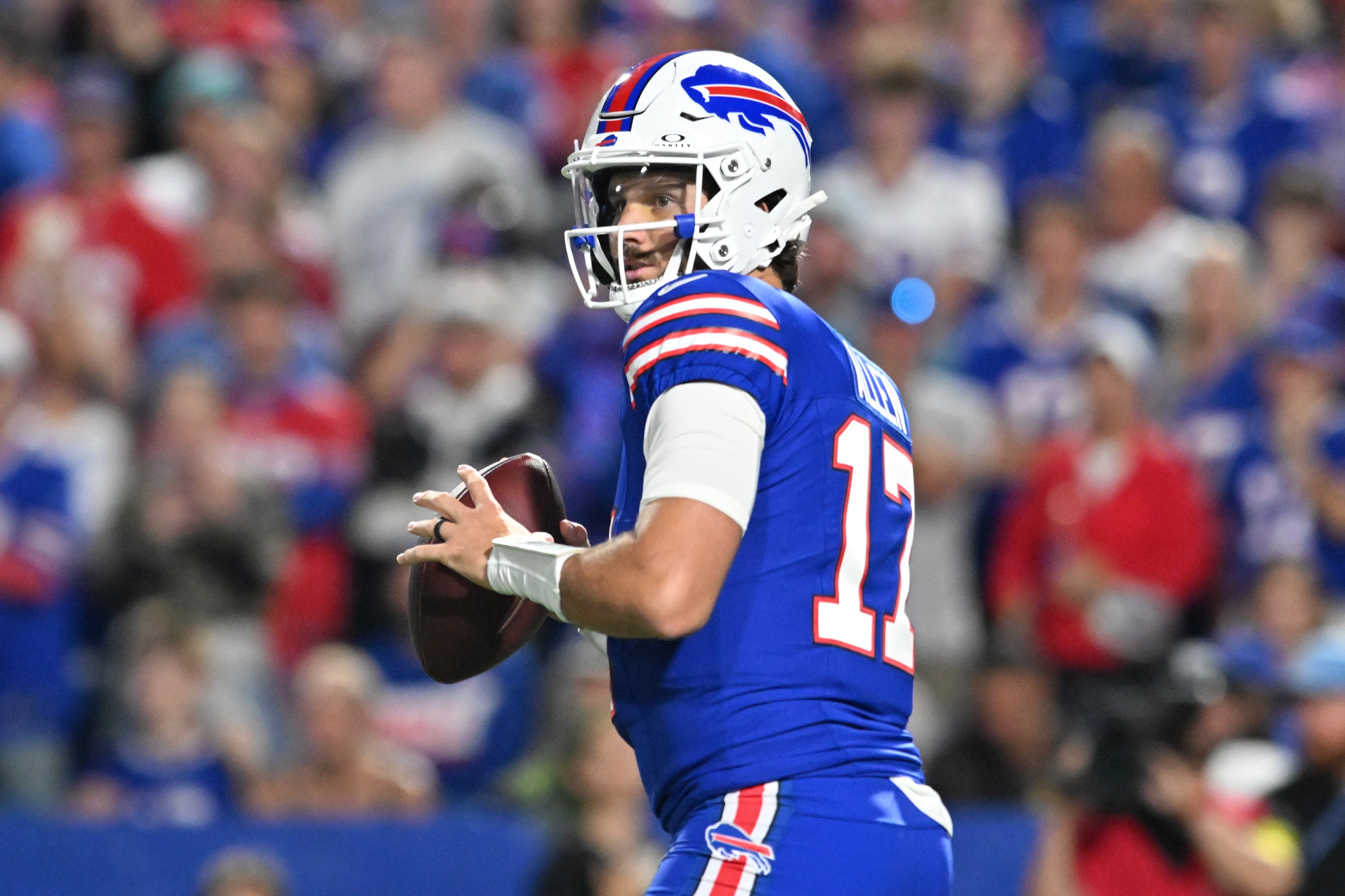 Sep 18, 2025; Orchard Park, New York, USA; Buffalo Bills quarterback Josh Allen (17) looks to pass against the Miami Dolphins in the first quarte at Highmark Stadium.