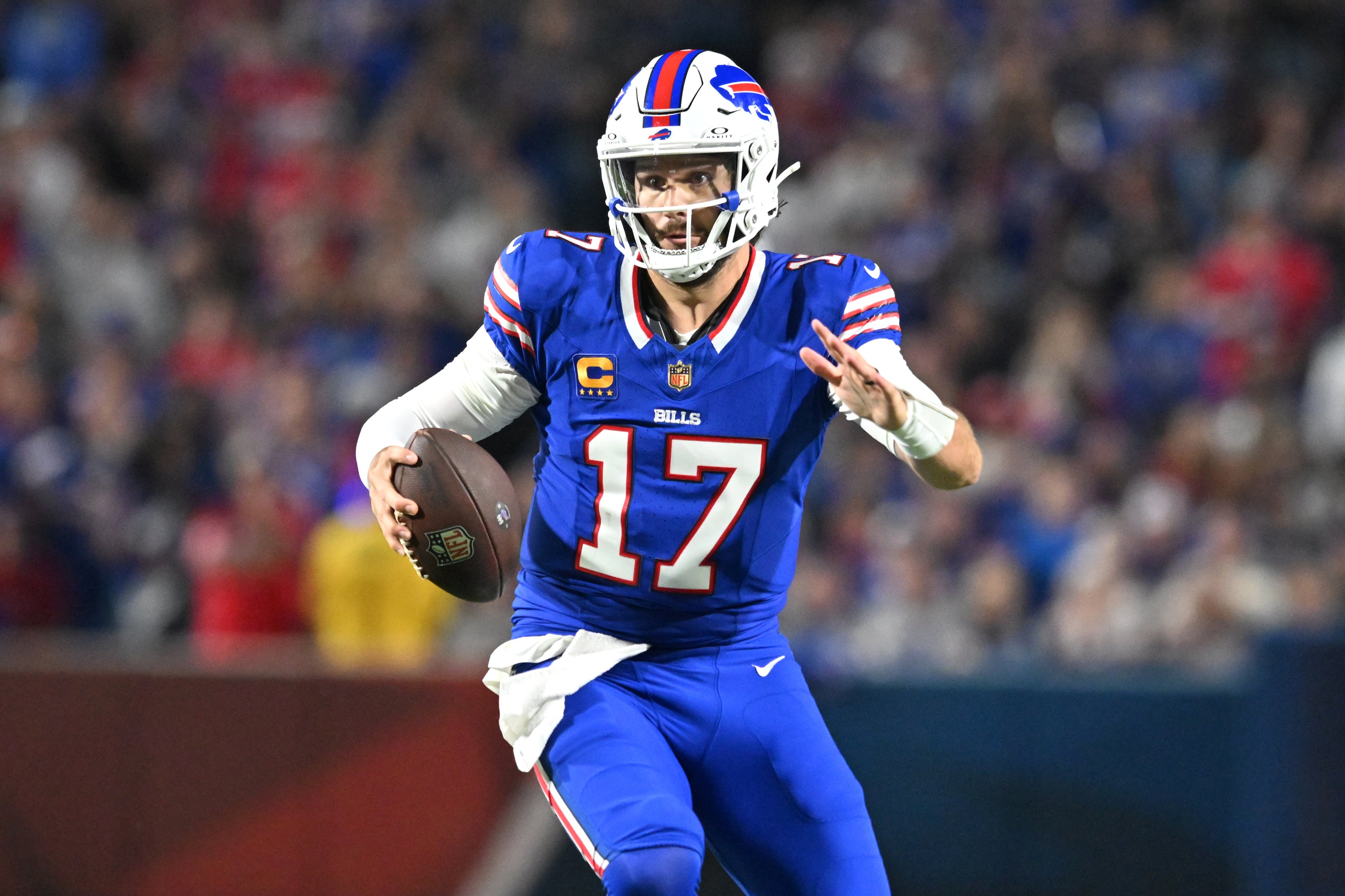 Sep 18, 2025; Orchard Park, New York, USA; Buffalo Bills quarterback Josh Allen (17) runs against the Miami Dolphins in the second half at Highmark Stadium.