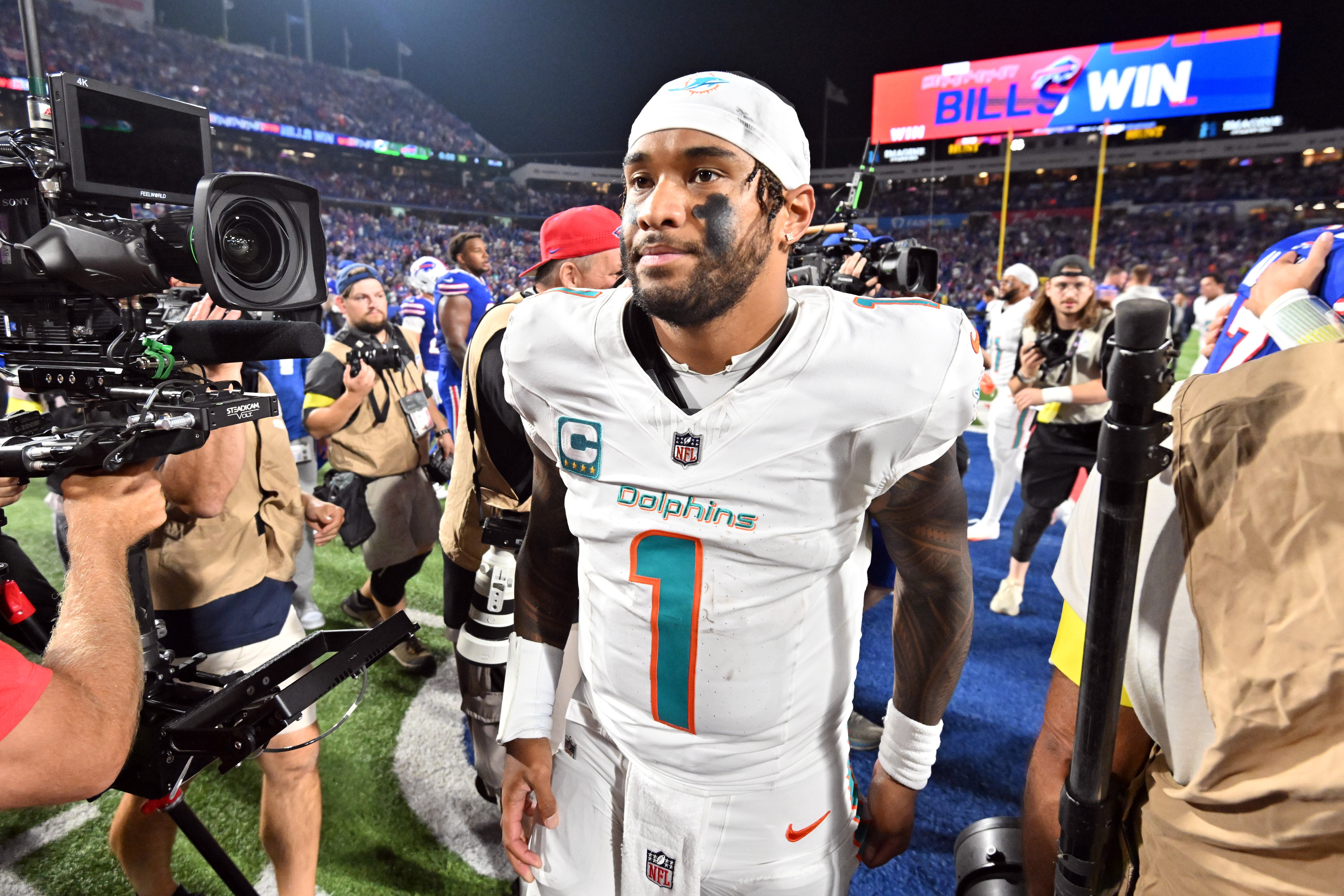 Sep 18, 2025; Orchard Park, New York, USA; Miami Dolphins quarterback Tua Tagovailoa (1) looks on after the game against the Buffalo Bills at Highmark Stadium.