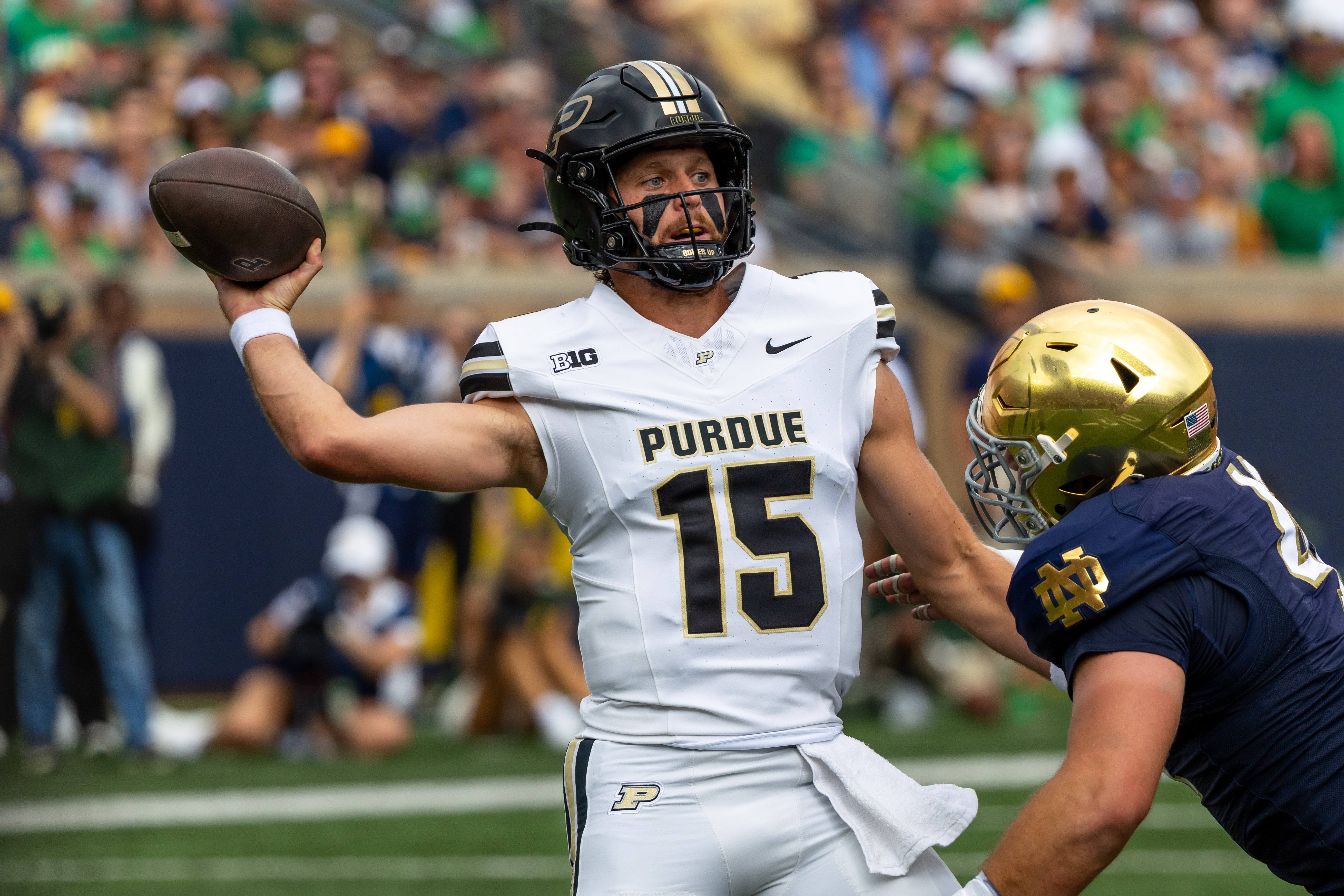 Sep 20, 2025; South Bend, Indiana, USA; Purdue Boilermakers quarterback Ryan Browne (15) throws a pass against the Notre Dame Fighting Irish during the first half at Notre Dame Stadium. Mandatory Credit: Michael Caterina-Imagn Images