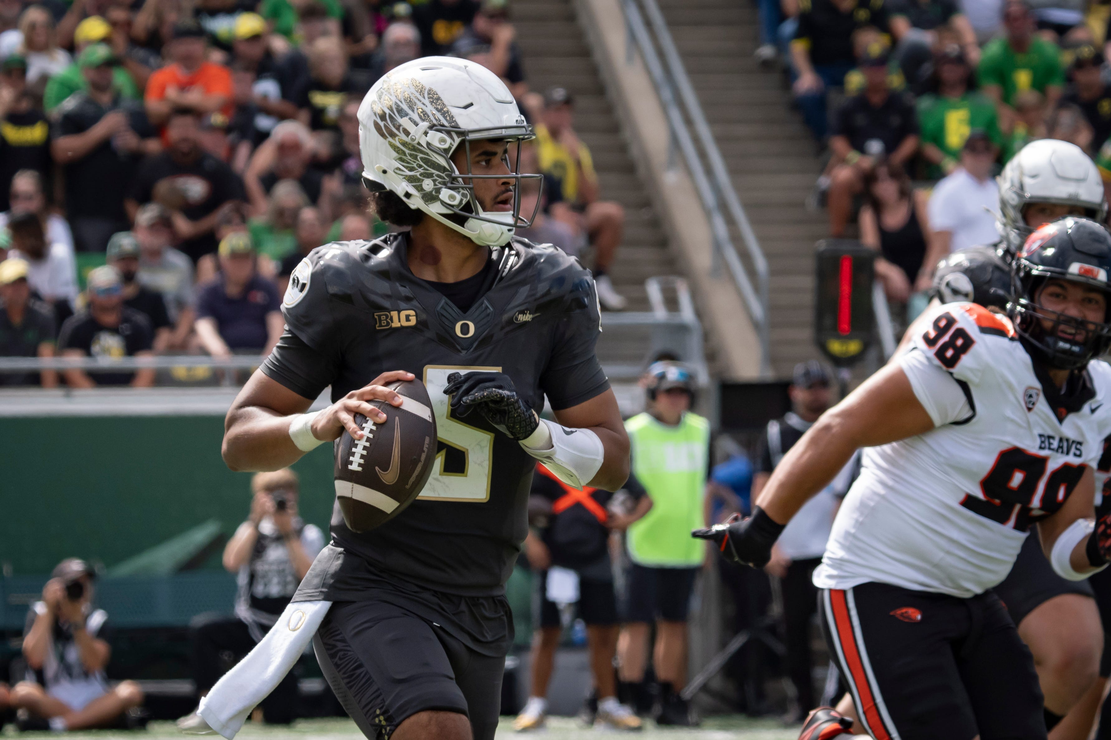 Oregon Ducks quarterback Dante Moore carries the ball as the Oregon Ducks host the Oregon State Beavers Sept. 20, 2025, at Autzen Stadium in Eugene, Oregon.
