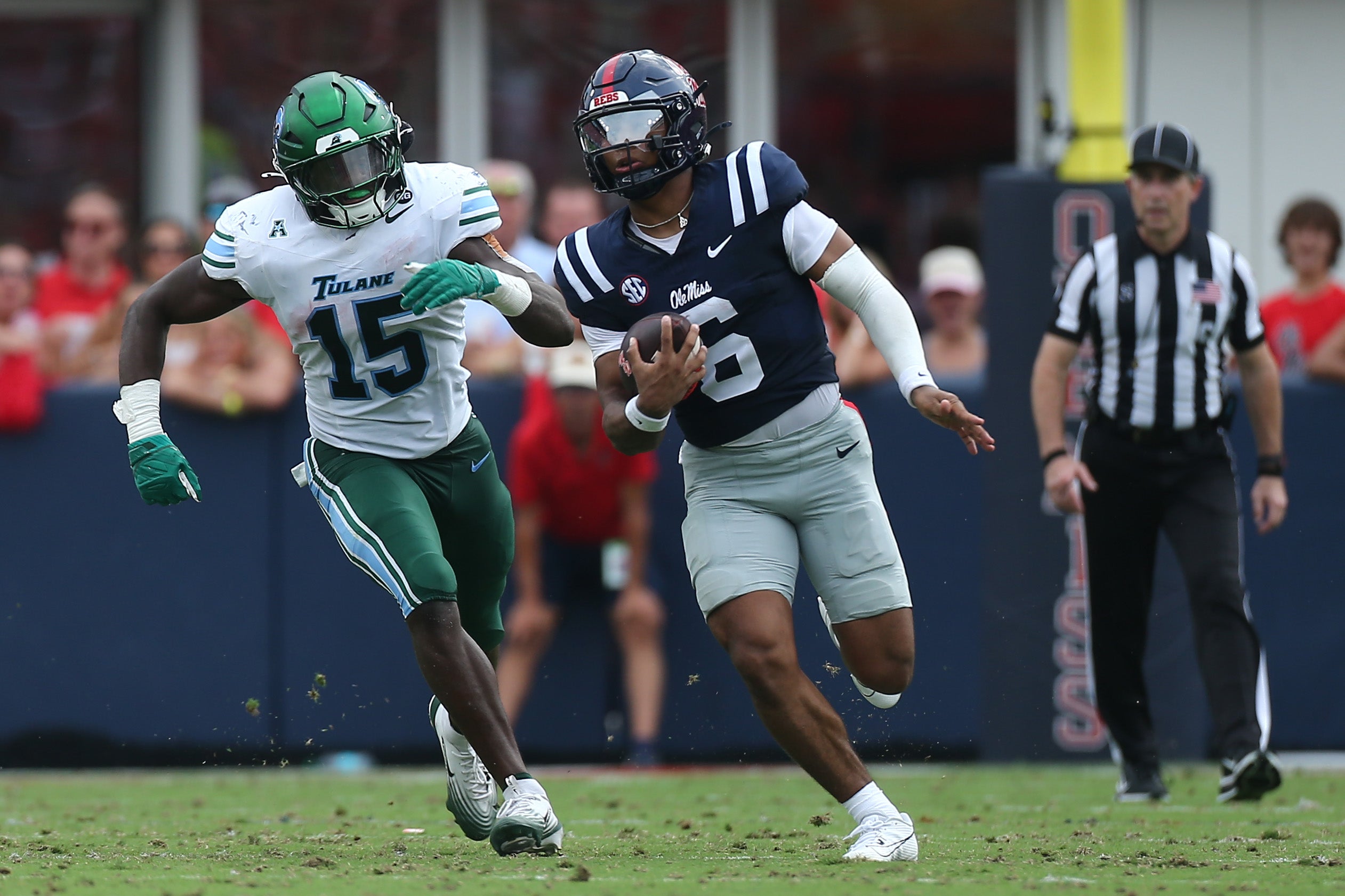 Sep 20, 2025; Oxford, Mississippi, USA; Mississippi Rebels quarterback Trinidad Chambliss (6) runs the ball as Tulane Green Wave linebacker Sam Howard (15) pursues during the second quarter at Vaught-Hemingway Stadium.