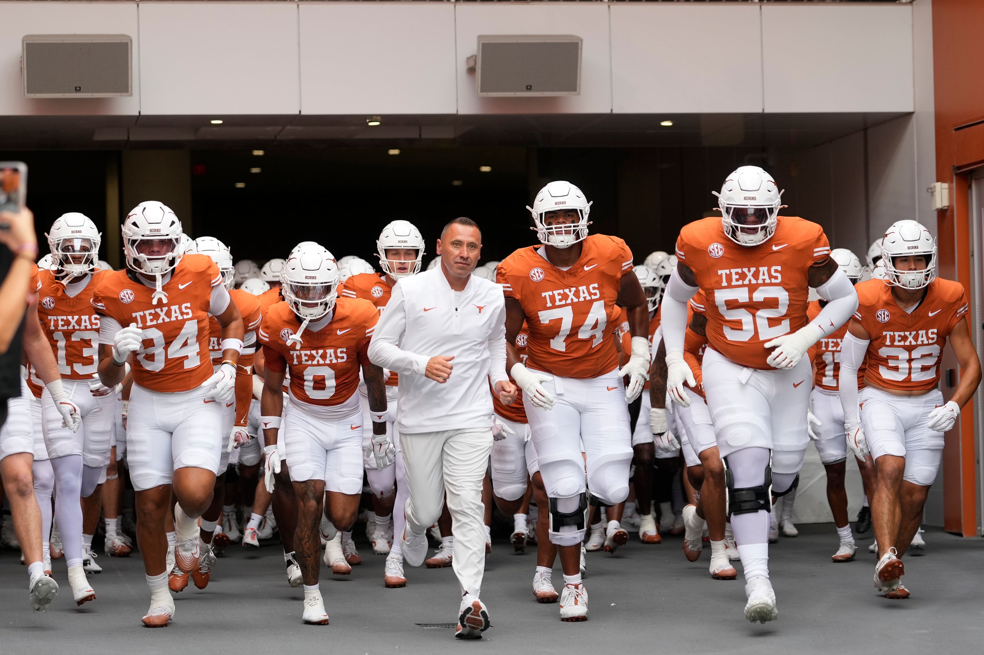 Sep 20, 2025; Austin, Texas, USA; Texas Longhorns head coach Steve Sarkisian leads his team on to the field before a game against the Sam Houston State Bearkats at Darrell K Royal-Texas Memorial Stadium. Mandatory Credit: Scott Wachter-Imagn Images