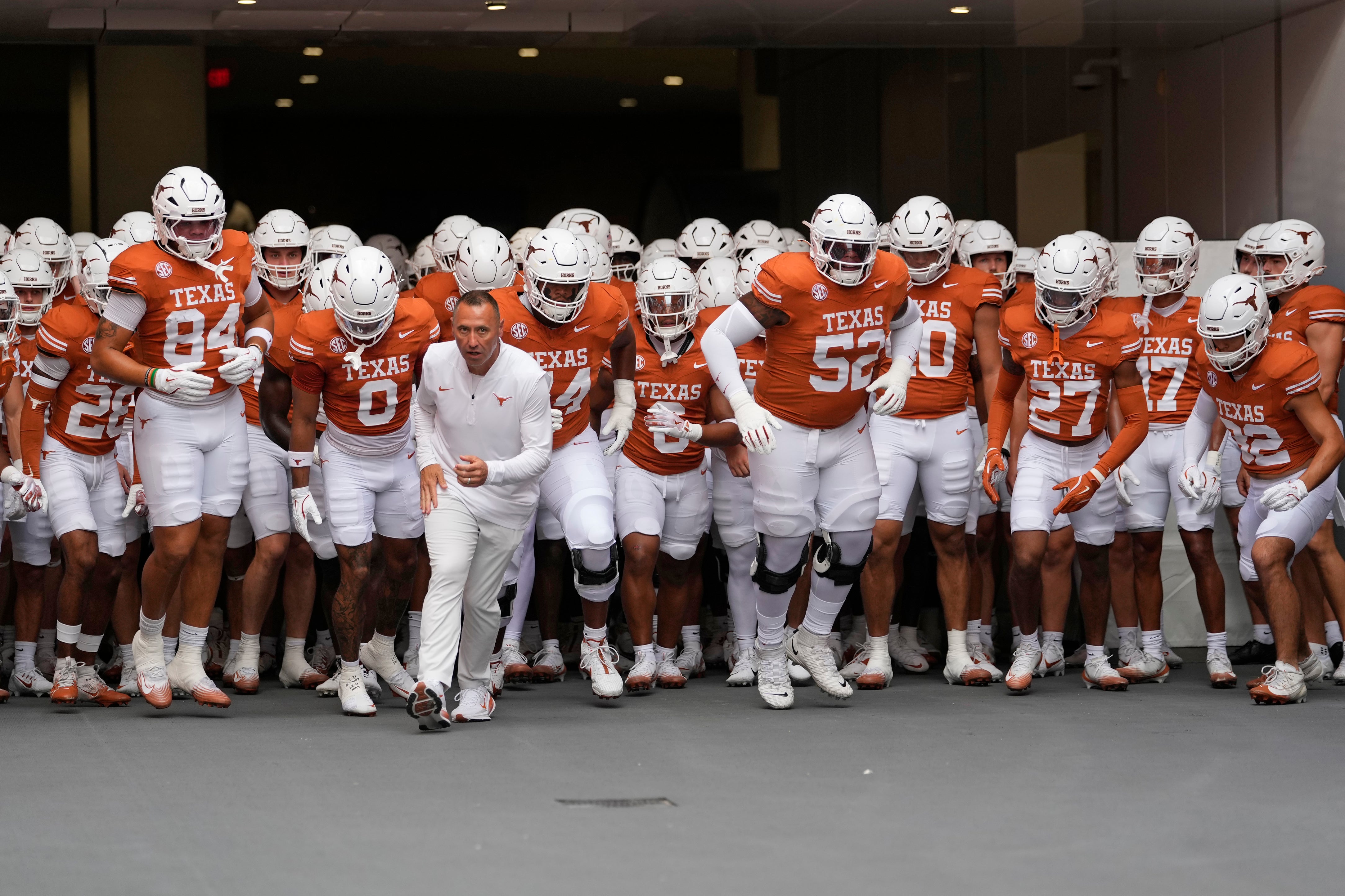 Sep 20, 2025; Austin, Texas, USA; Texas Longhorns head coach Steve Sarkisian leads his team on to the field before a game against the Sam Houston State Bearkats at Darrell K Royal-Texas Memorial Stadium.