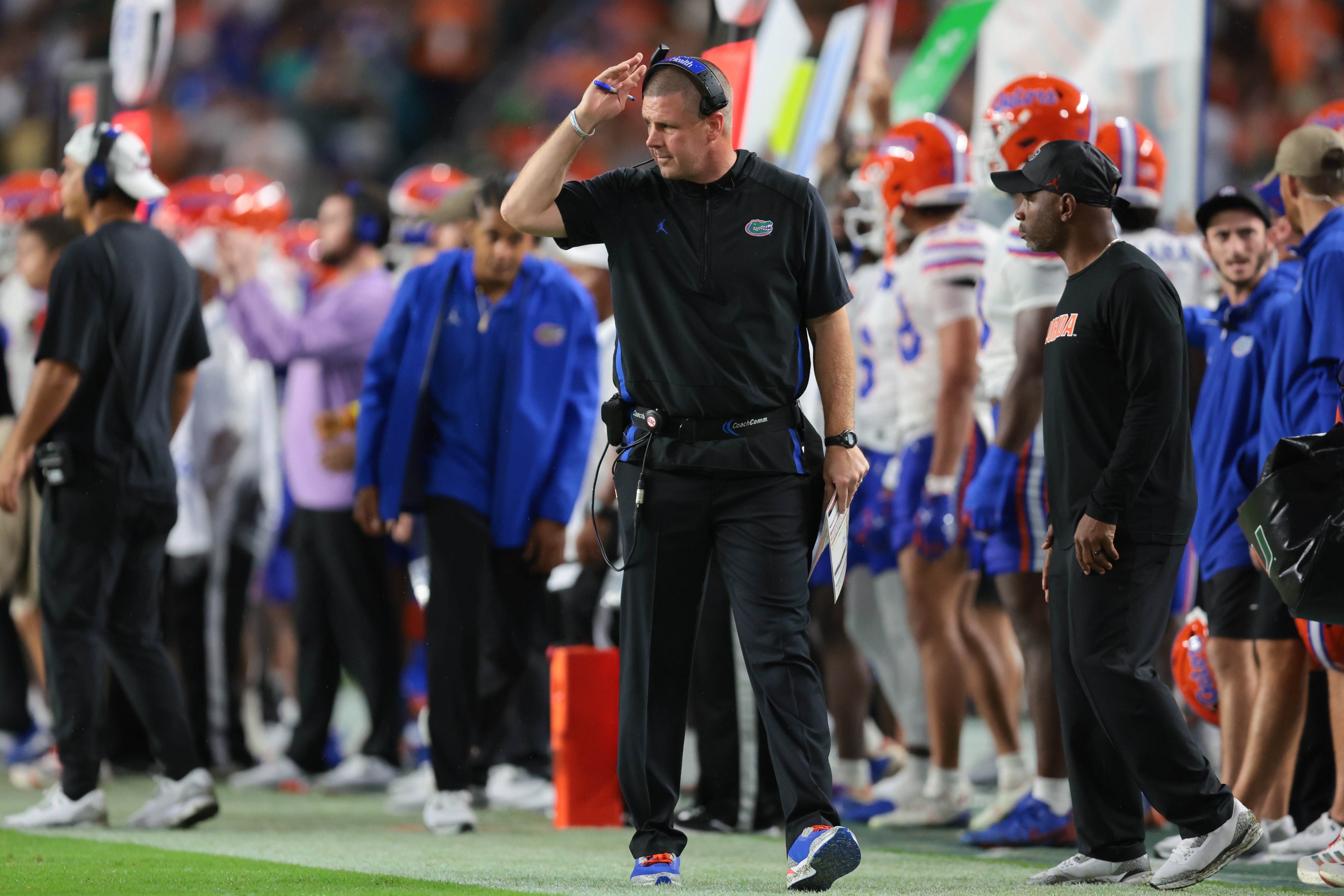 Sep 20, 2025; Miami Gardens, Florida, USA; Florida Gators head coach Billy Napier watches from the sideline against the Miami Hurricanes during the second quarter at Hard Rock Stadium.