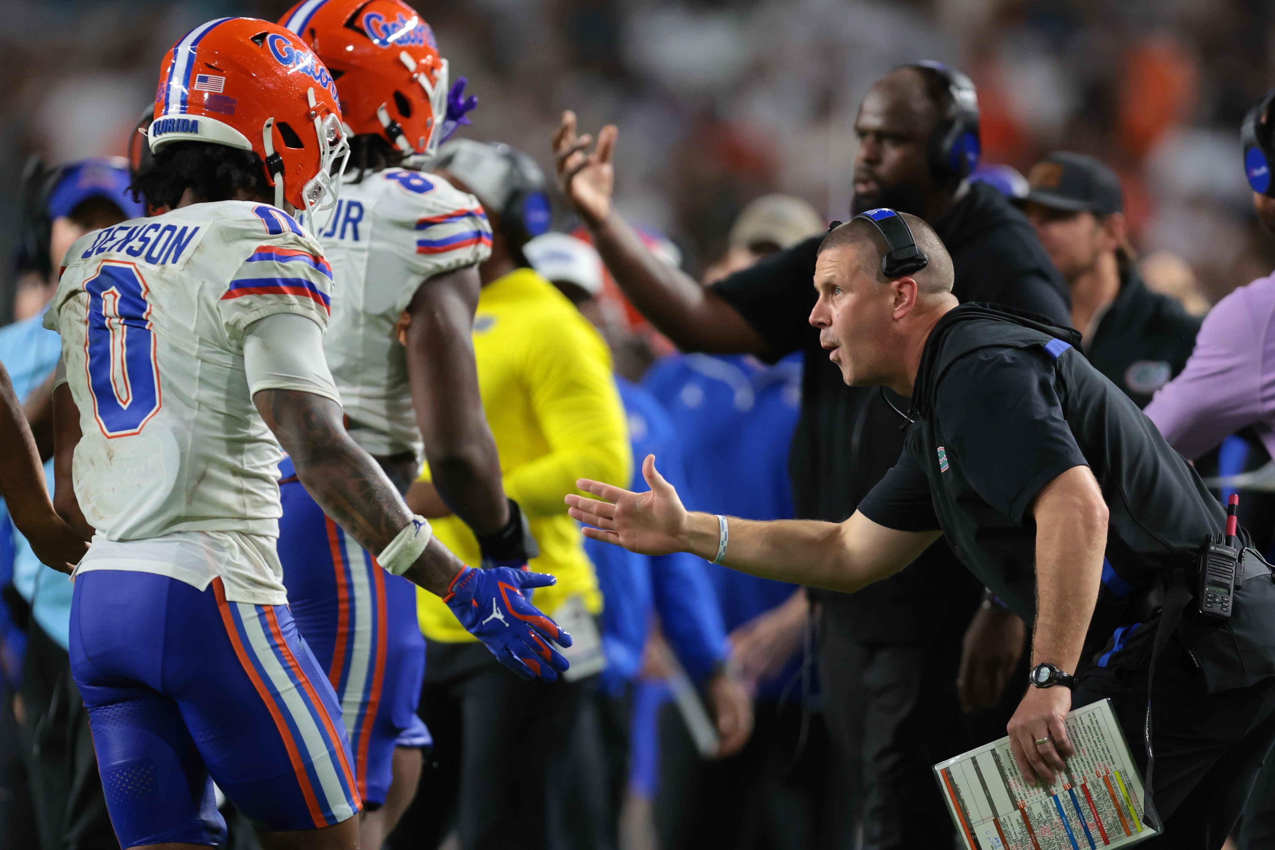 Sep 20, 2025; Miami Gardens, Florida, USA; Florida Gators head coach Billy Napier high-fives defensive back Sharif Denson (0) against the Miami Hurricanes during the second quarter at Hard Rock Stadium.