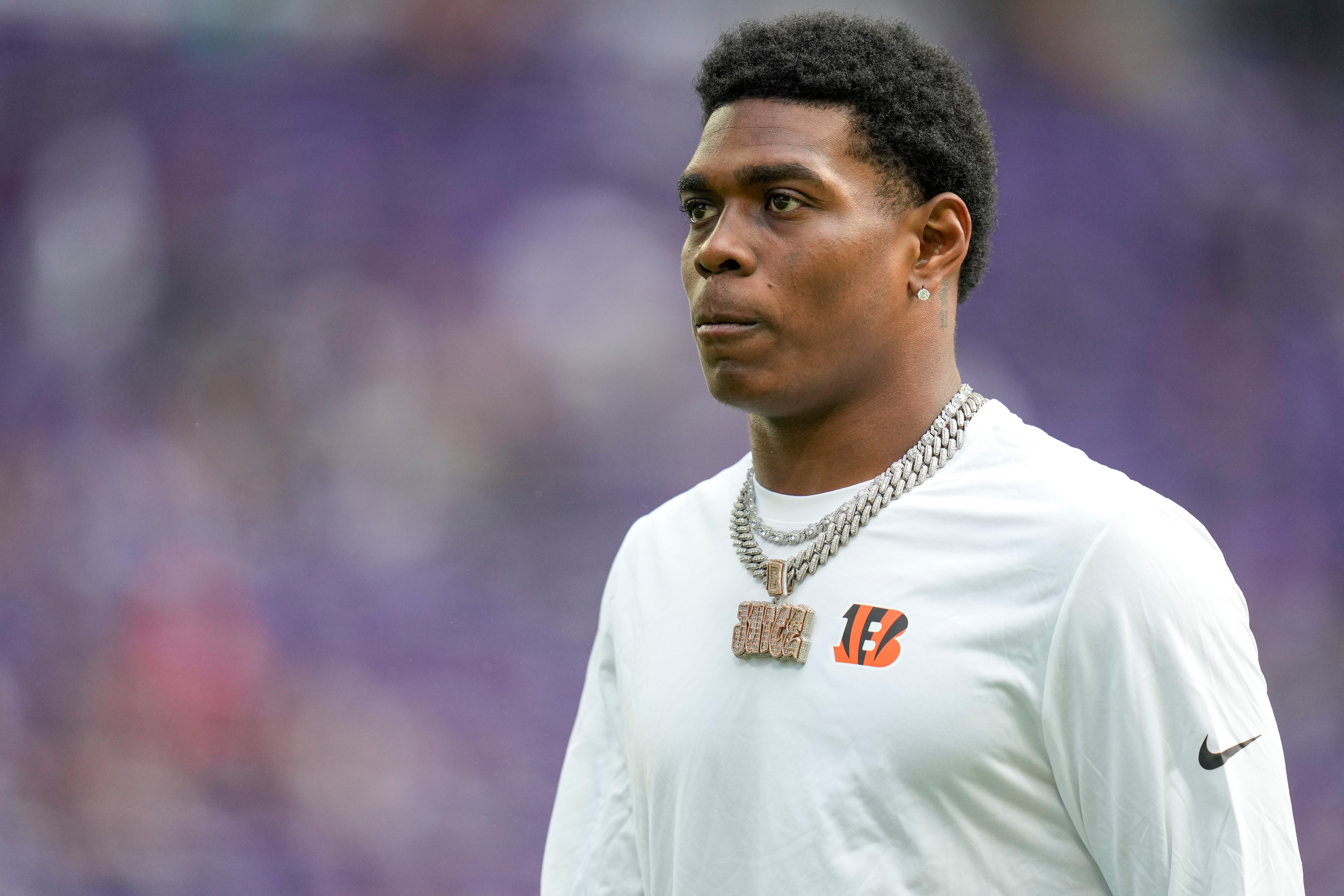 Injured Cincinnati Bengals cornerback Cam Taylor-Britt (29) walks the field during warmups before the first quarter of the NFL Week 3 game between the Minnesota Vikings and the Cincinnati Bengals at U.S. Bank Stadium in Minneapolis on Sunday, Sept. 21, 2025.