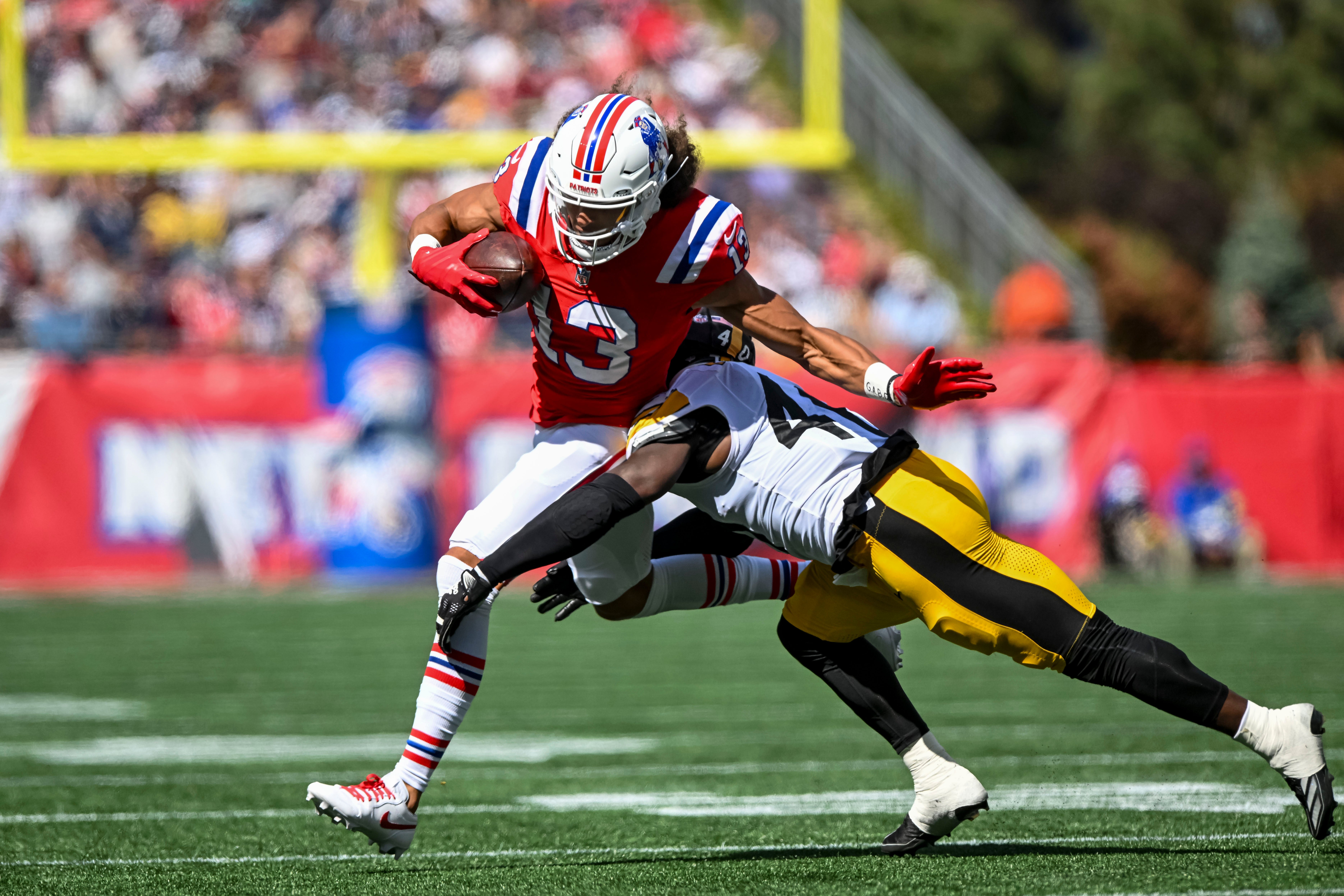 Sep 21, 2025; Foxborough, Massachusetts, USA; Pittsburgh Steelers saftey Jabrill Peppers tackles New England Patriots wide receiver Mack Hollins (13) during the second quarter at Gillette Stadium.