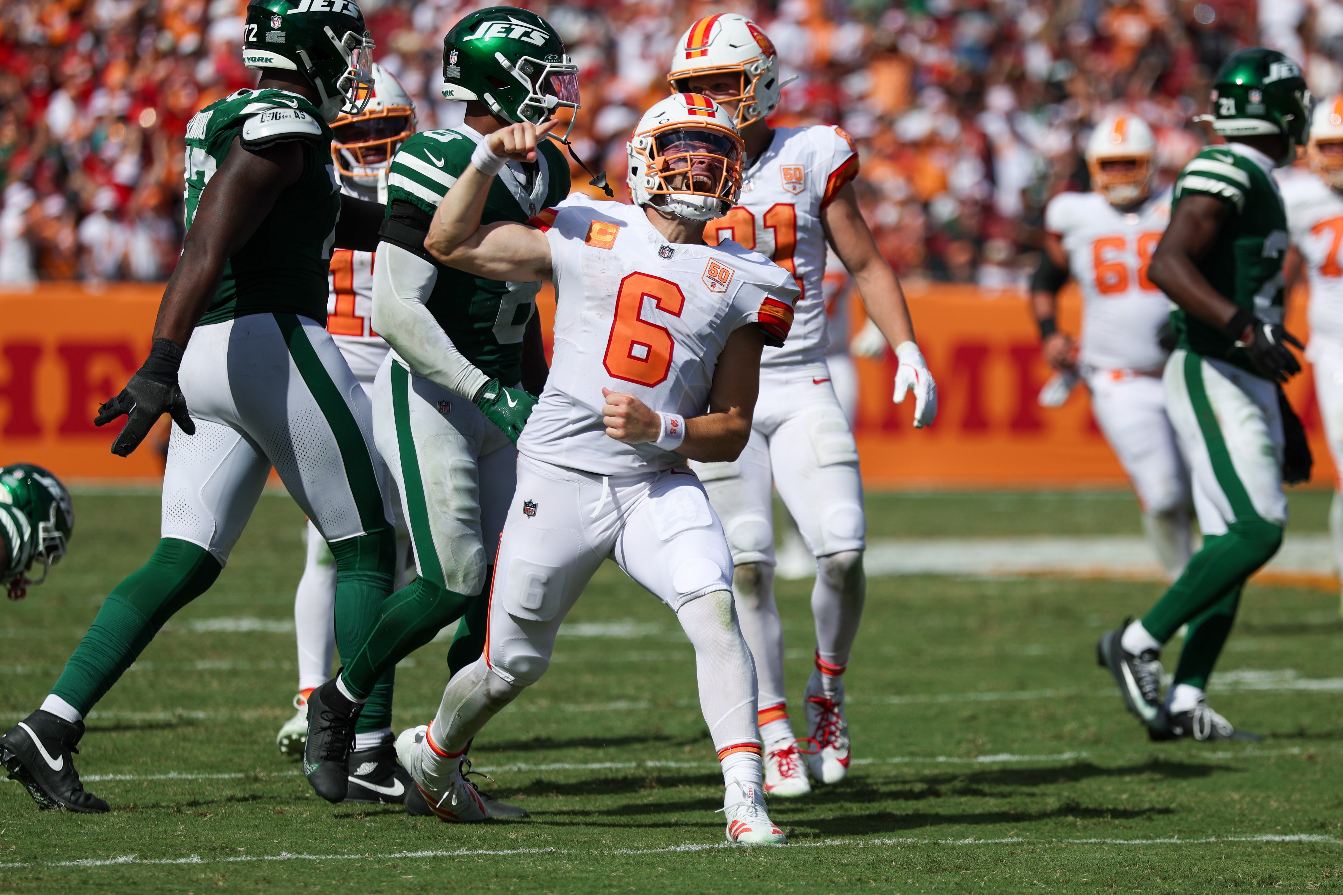Sep 21, 2025; Tampa, Florida, USA; Tampa Bay Buccaneers quarterback Baker Mayfield (6) reacts after a run against the New York Jets in the fourth quarter at Raymond James Stadium.
