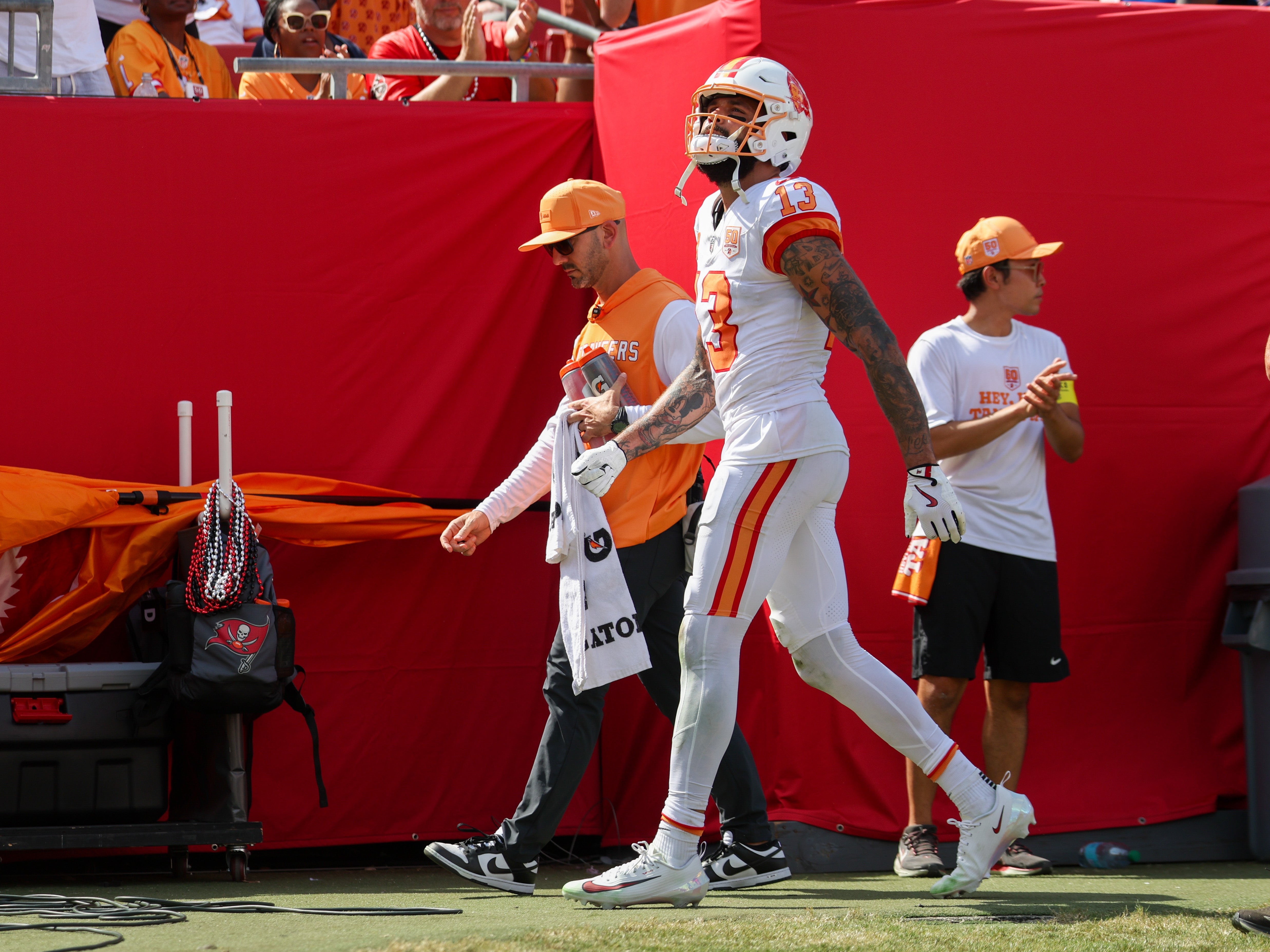 Sep 21, 2025; Tampa, Florida, USA; Tampa Bay Buccaneers wide receiver Mike Evans (13) walks to the locker room against the New York Jets in the fourth quarter at Raymond James Stadium.
