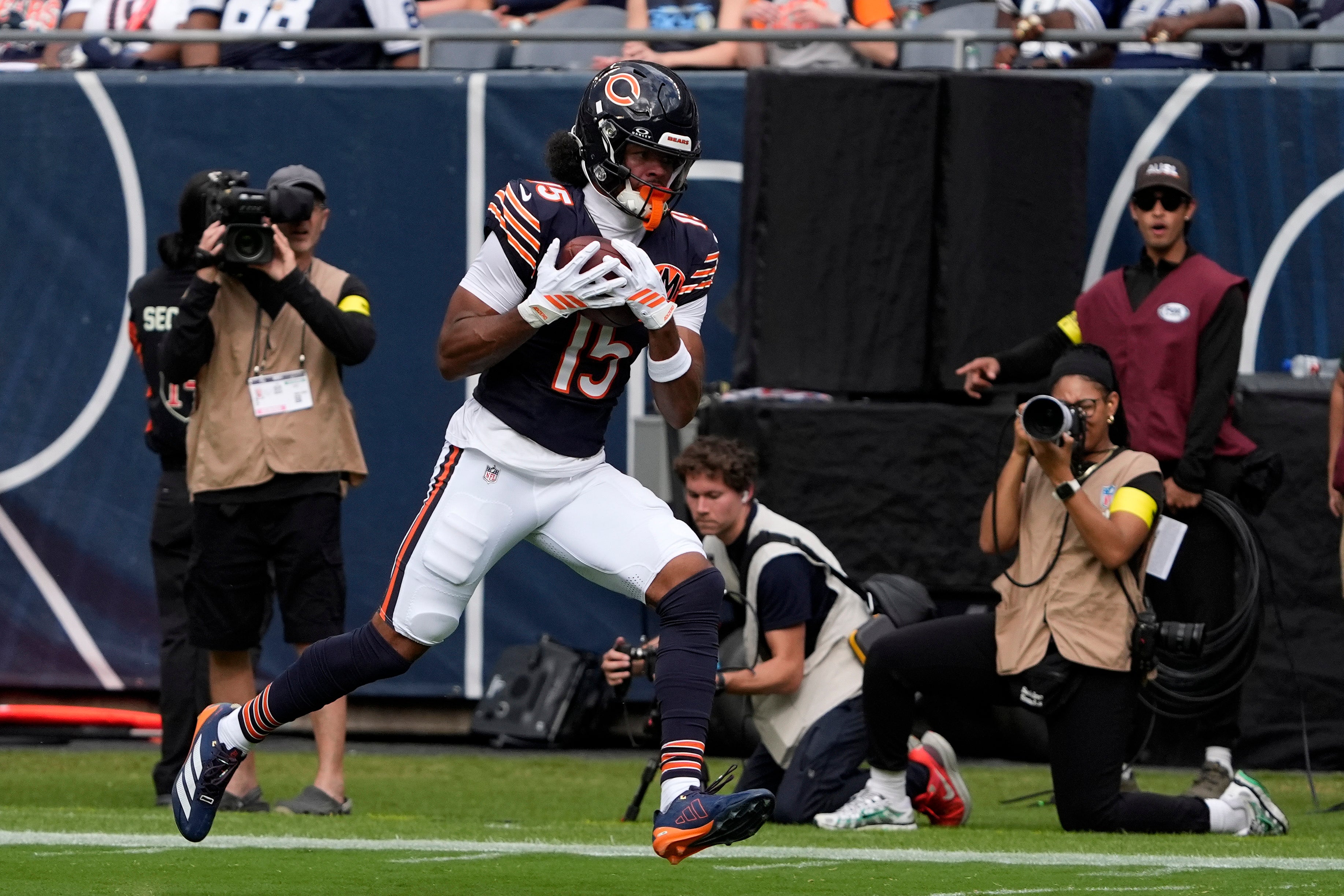 Sep 21, 2025; Chicago, Illinois, USA; Chicago Bears wide receiver Rome Odunze (15) makes a touchdown catch against the Dallas Cowboys during the first half at Soldier Field.