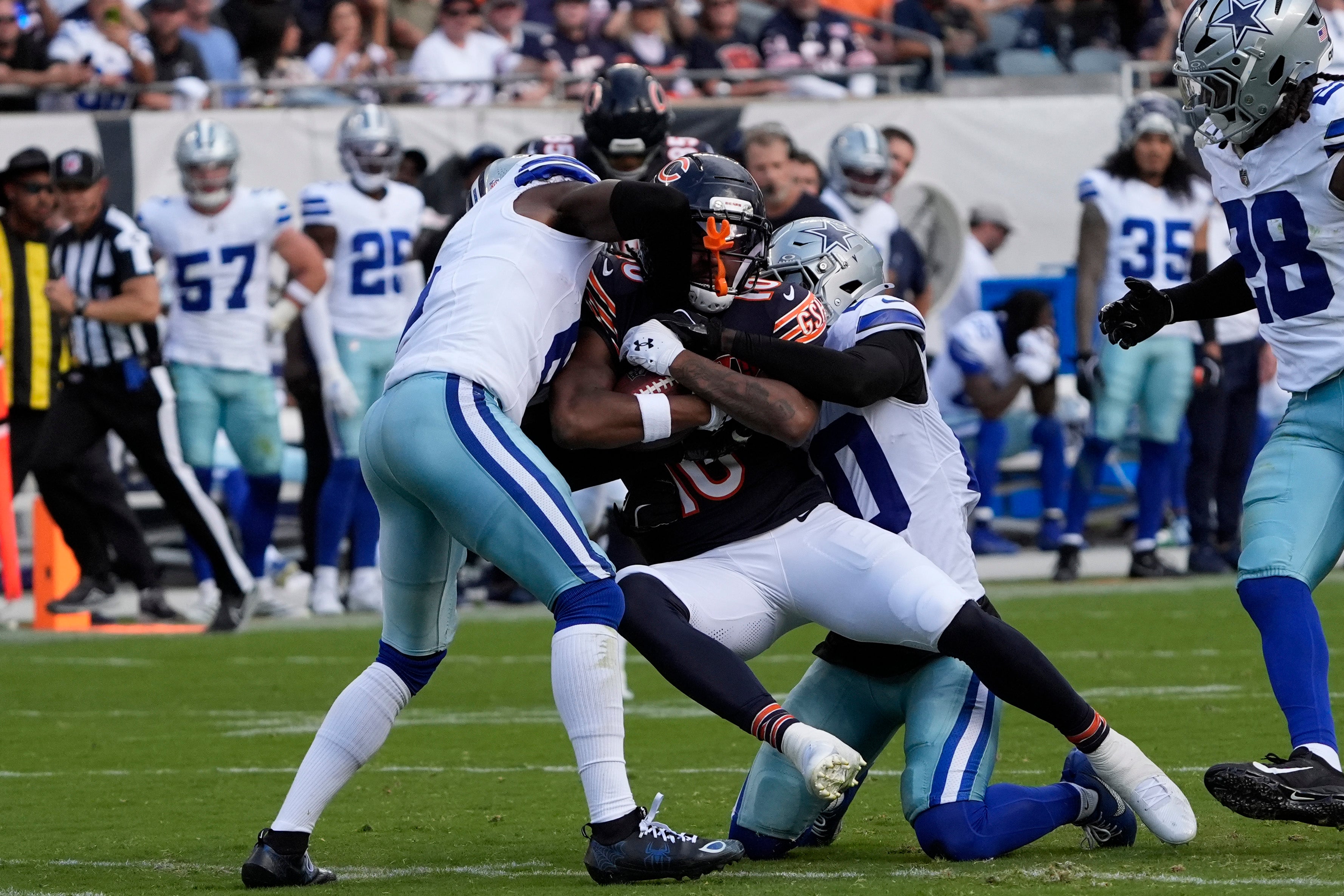 Sep 21, 2025; Chicago, Illinois, USA; Chicago Bears wide receiver Luther Burden III (10) catches a pass against the Dallas Cowboys during the first half at Soldier Field.