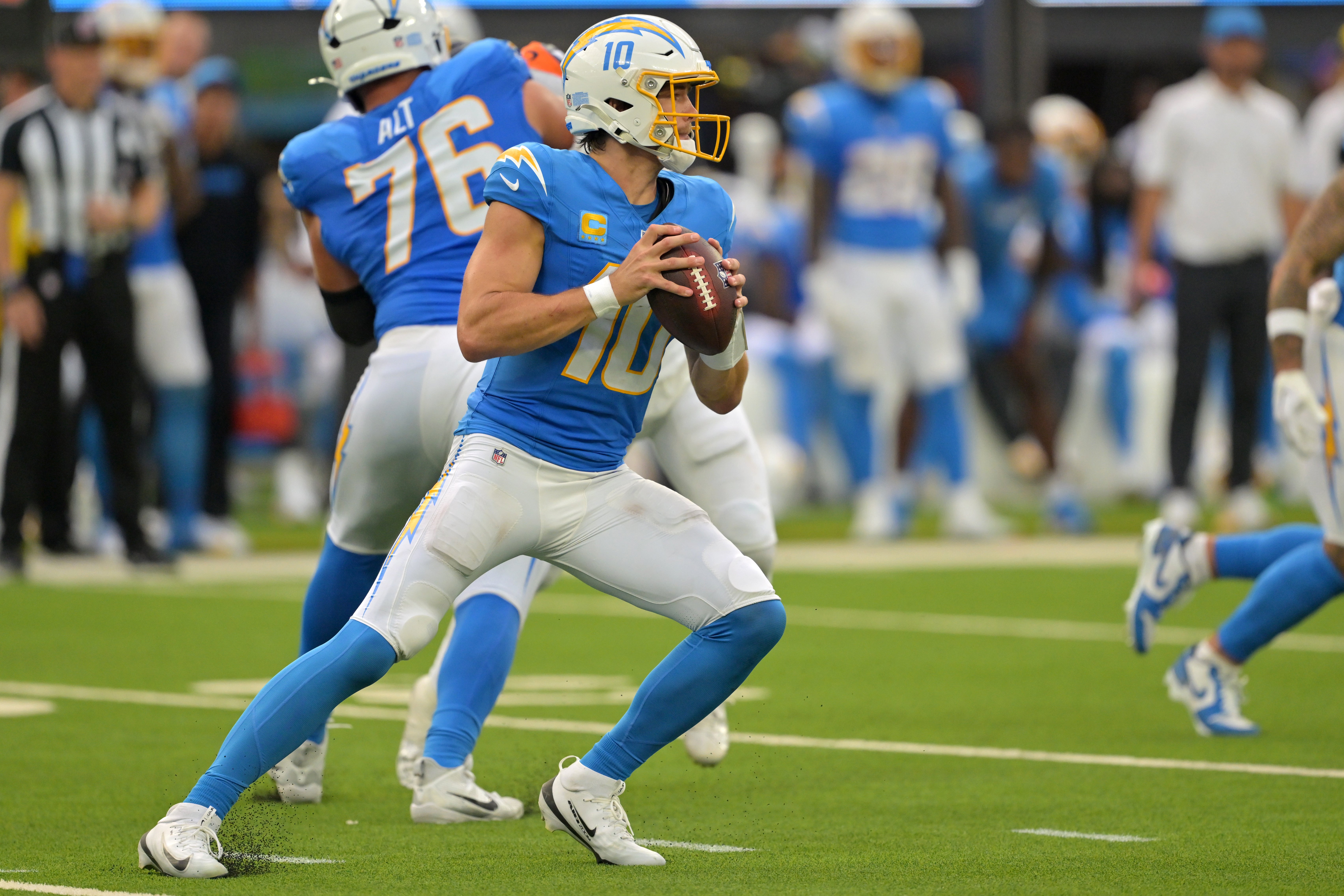 Sep 21, 2025; Inglewood, California, USA; Los Angeles Chargers quarterback Justin Herbert (10) looks to pass in the second half against the Denver Broncos at SoFi Stadium. Mandatory Credit: Jayne Kamin-Oncea-Imagn Images