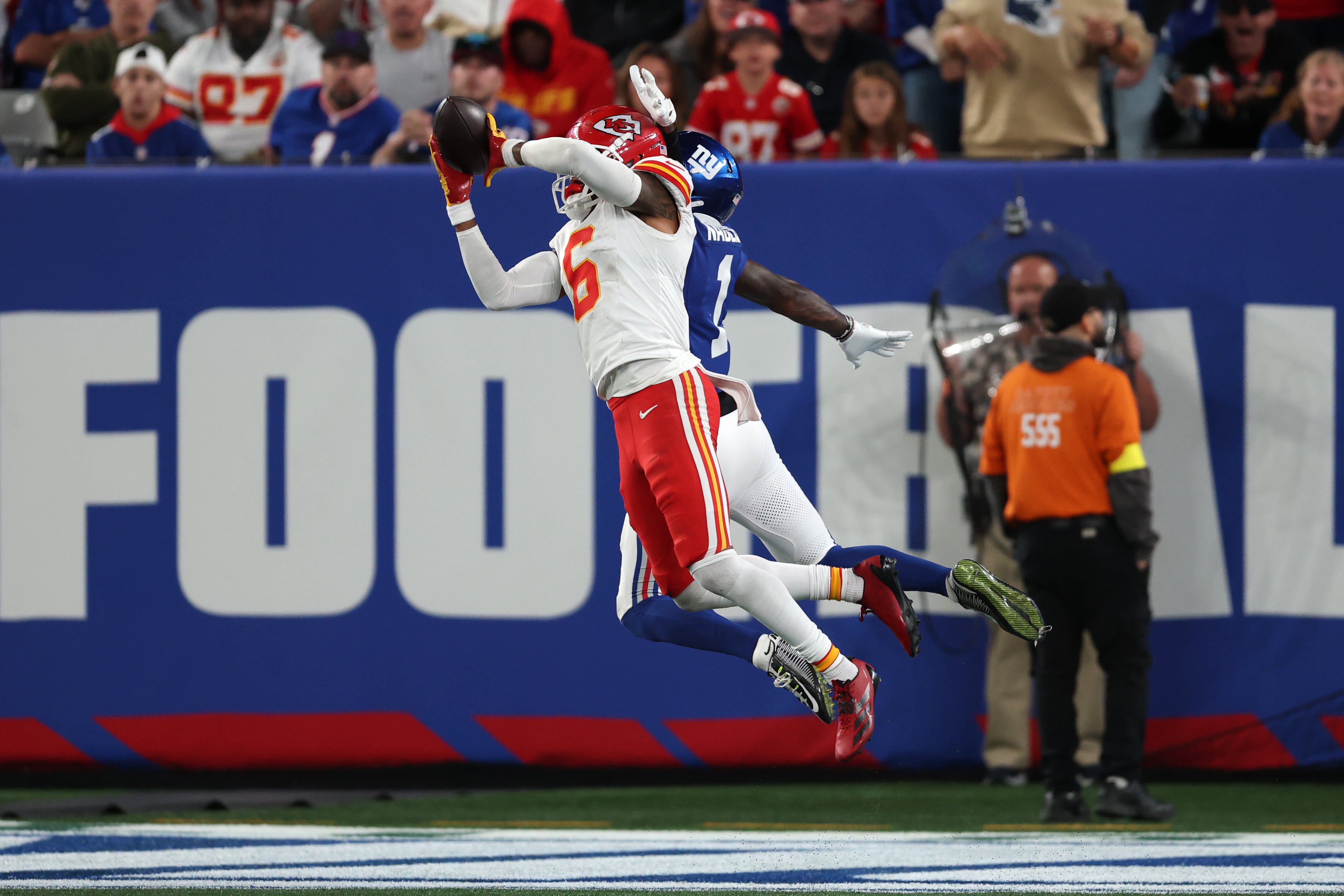 Kansas City Chiefs safety Bryan Cook (6) breaks up a pass and collides with New York Giants wide receiver Malik Nabers (1) in the fourth quarter at MetLife Stadium.
