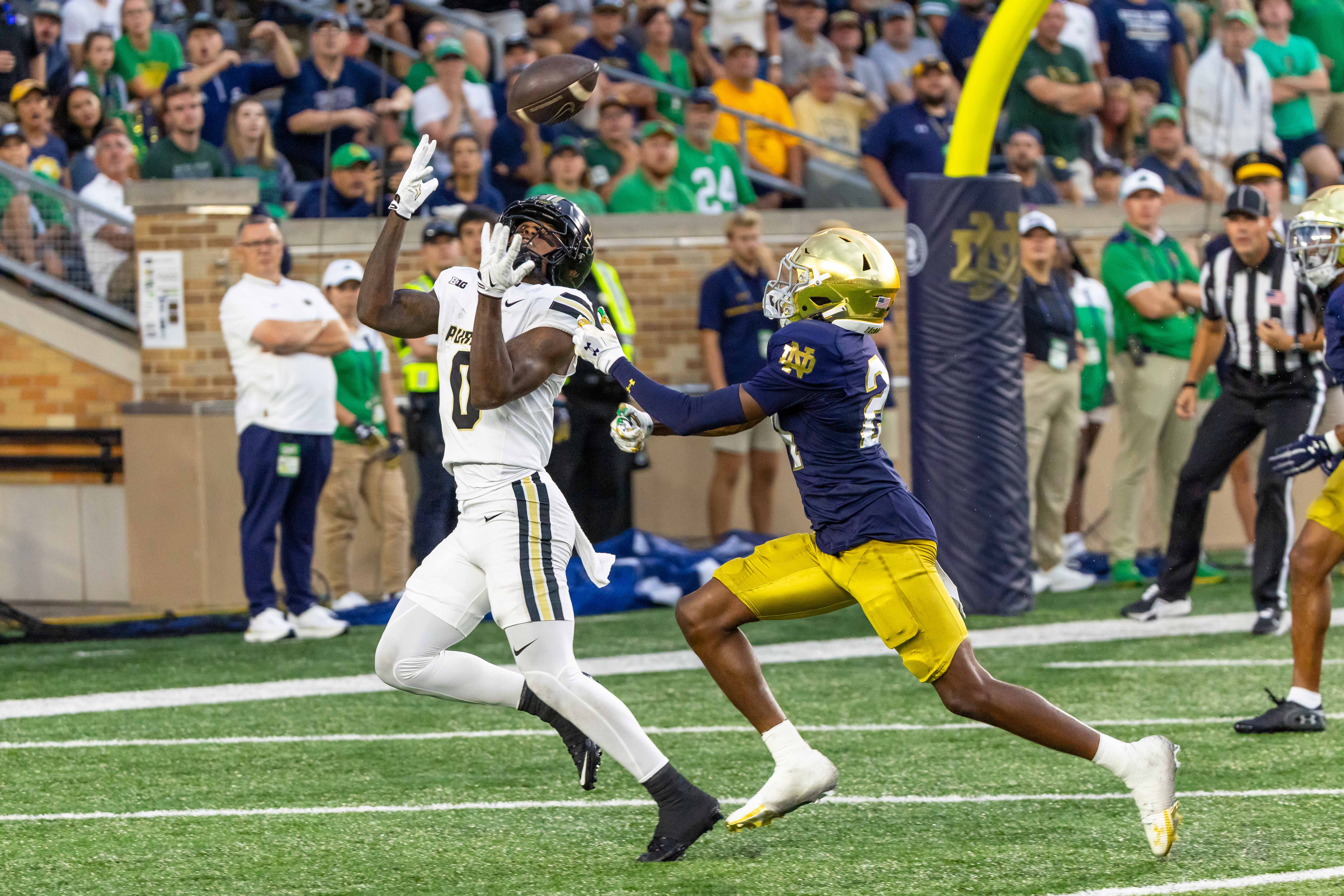 Sep 20, 2025; South Bend, Indiana, USA; Purdue Boilermakers wide receiver Nitro Tuggle (0) makes a catch for a touchdown as Notre Dame Fighting Irish cornerback Mark Zackery IV (24) defends in the first half at Notre Dame Stadium. Mandatory Credit: Michael Caterina-Imagn Images