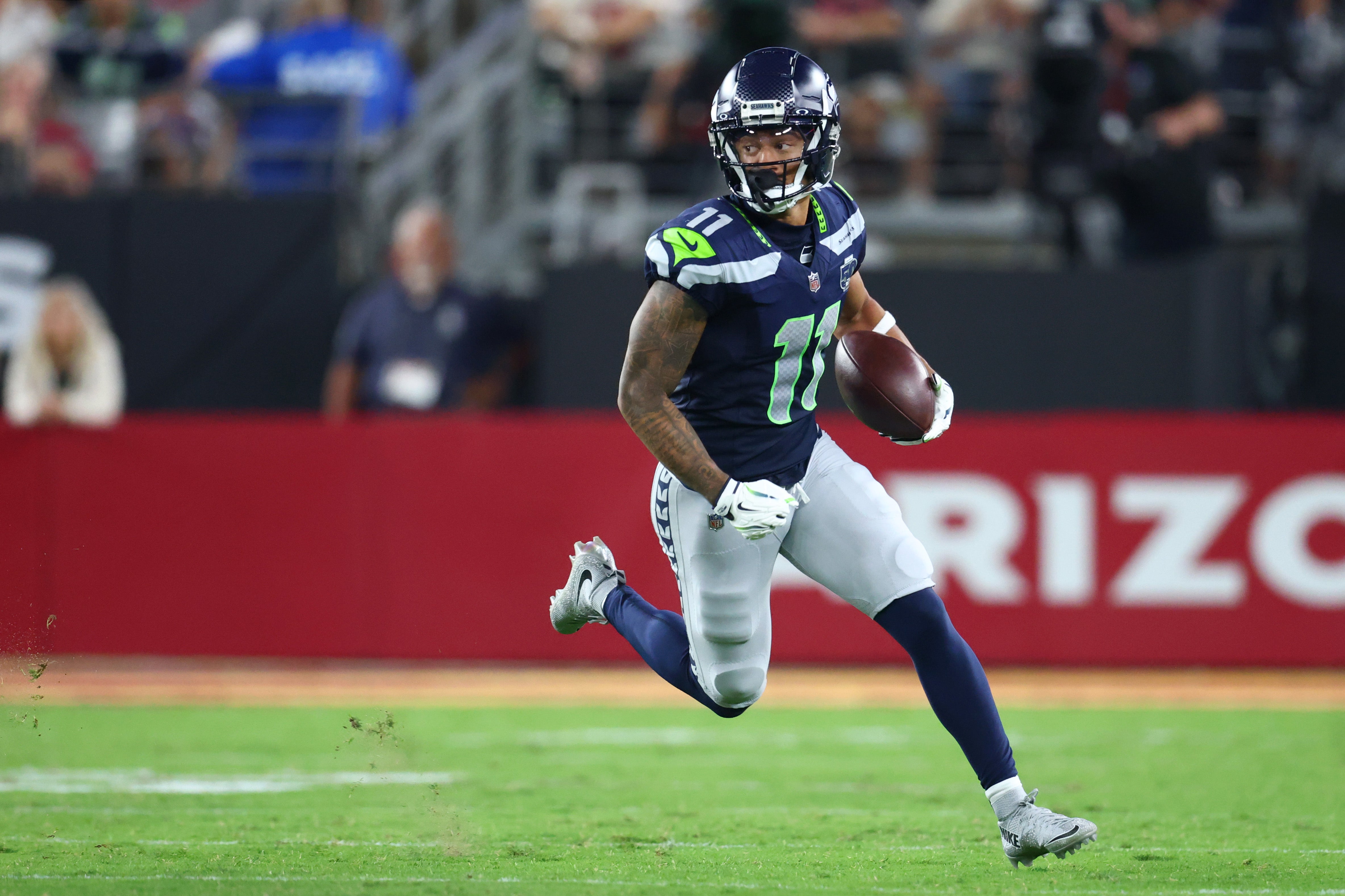 Sep 25, 2025; Glendale, Arizona, USA; Seattle Seahawks wide receiver Jaxon Smith-Njigba (11) runs against the Arizona Cardinals in the third quarter at State Farm Stadium.