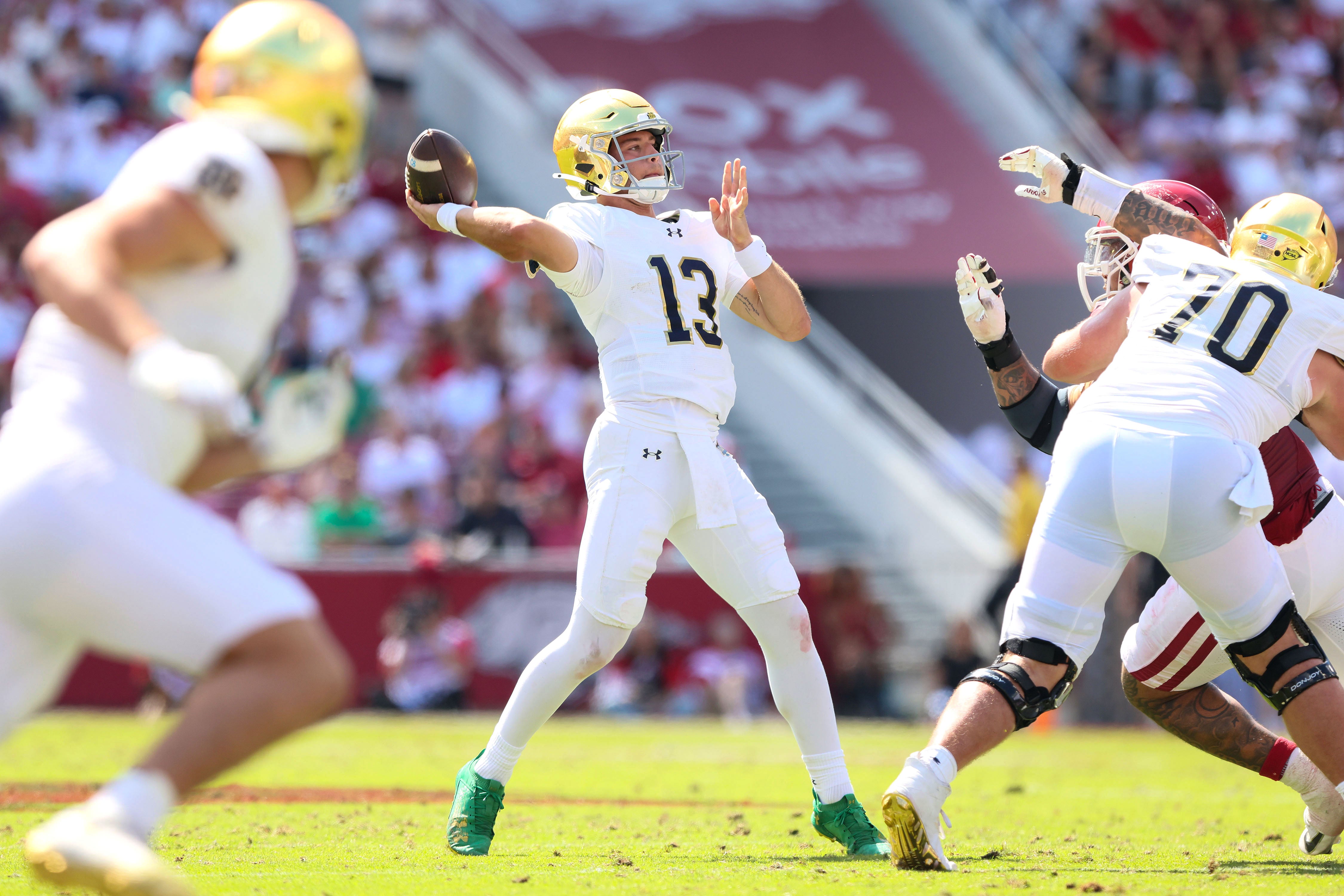 Sep 27, 2025; Fayetteville, Arkansas, USA; Notre Dame Fighting Irish quarterback CJ Carr (13) passes during the third quarter against the Arkansas Razorbacks at Donald W. Reynolds Razorback Stadium. Notre Dame won 56-13. Mandatory Credit: Nelson Chenault-Imagn Images